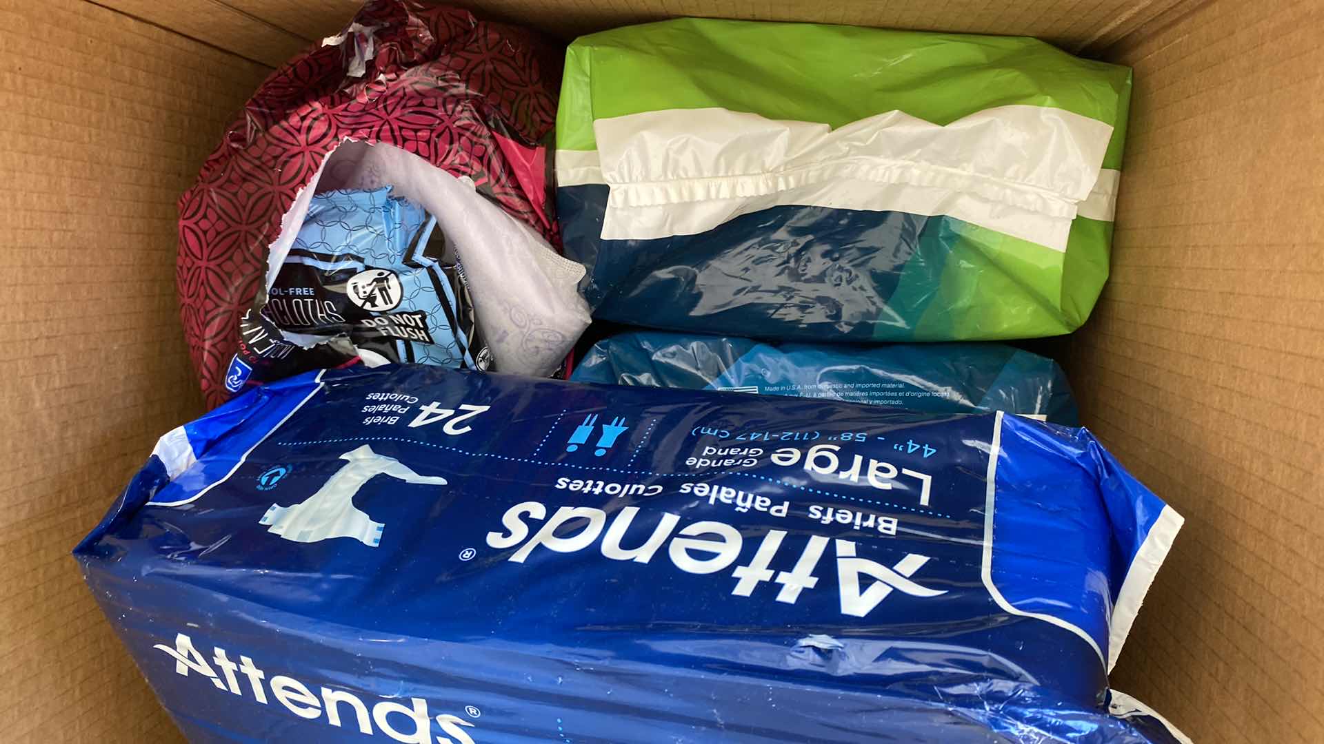 Photo 1 of 2 BOXES LARGE BOX OF DIAPERS AND PADS