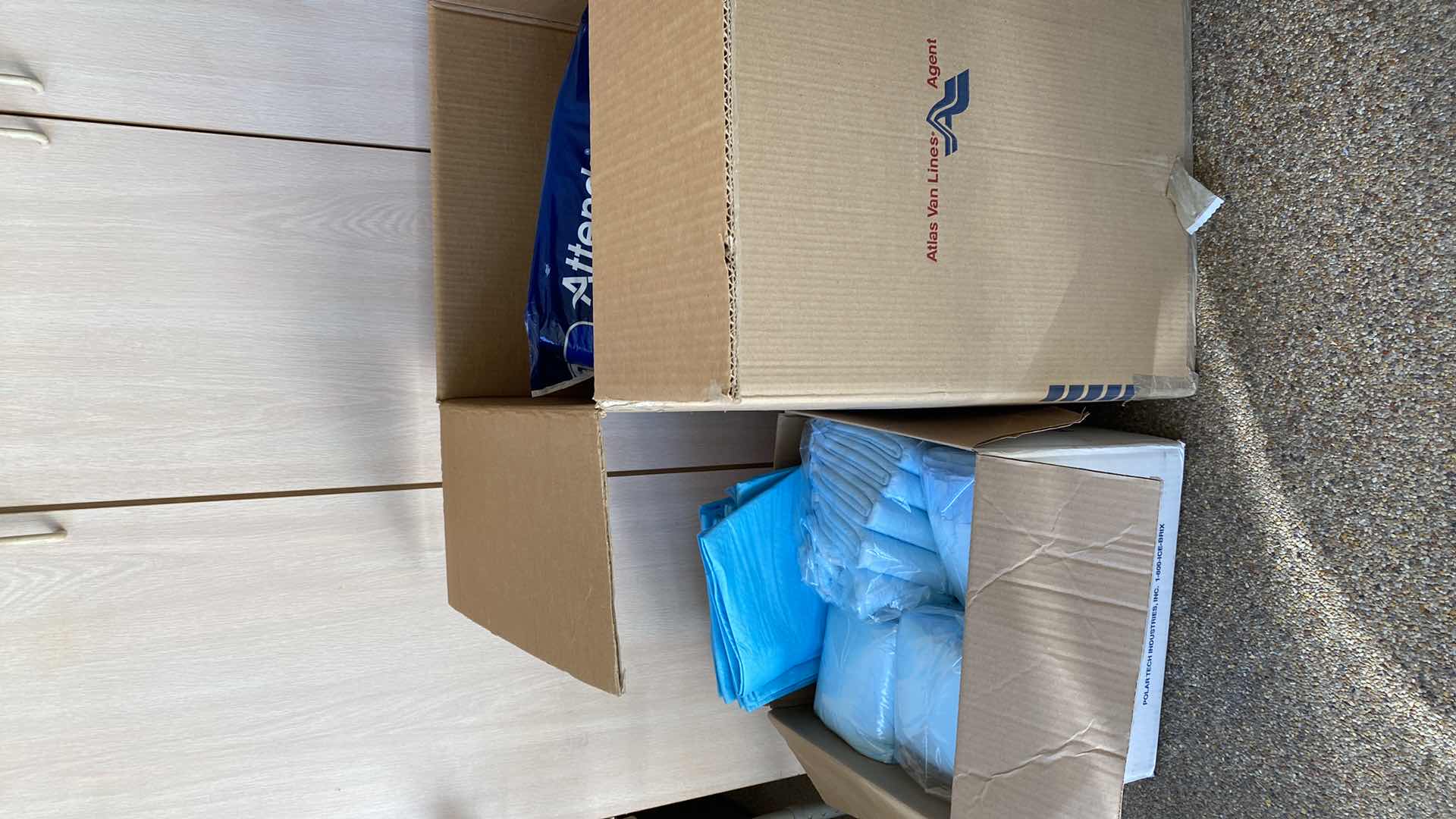 Photo 1 of 2 BOXES LARGE BOX OF DIAPERS AND PADS