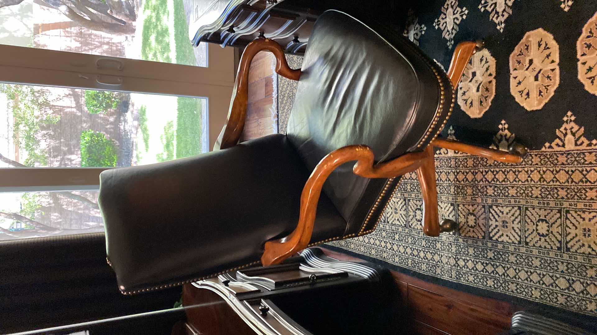 Photo 1 of BLACK LEATHER W WOOD ACCENTS SWIVEL EXECUTIVE DESK CHAIR