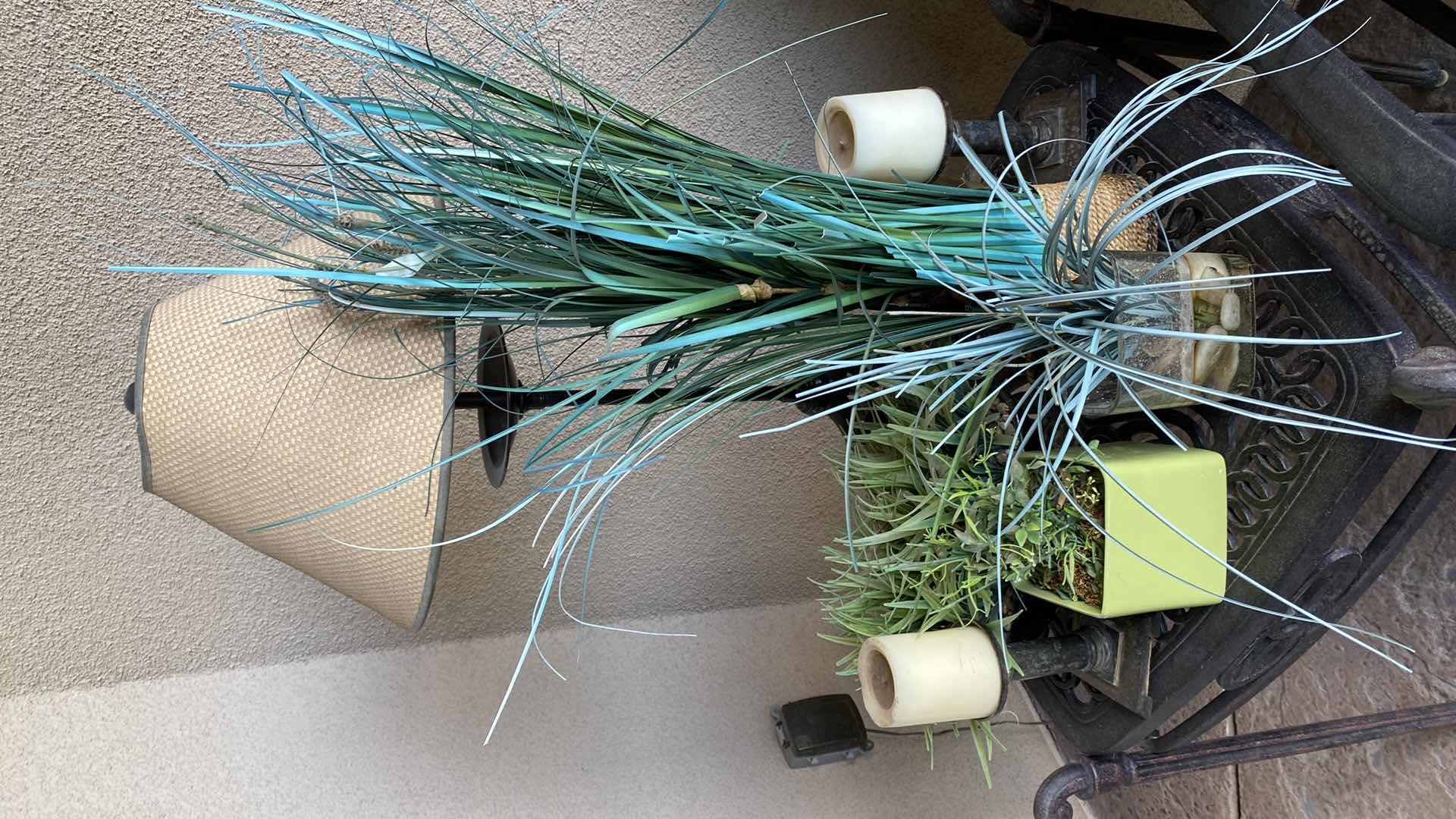 Photo 1 of OUTDOOR TABLE LAMP H 32” CANDLES AND FAUX PLANTS