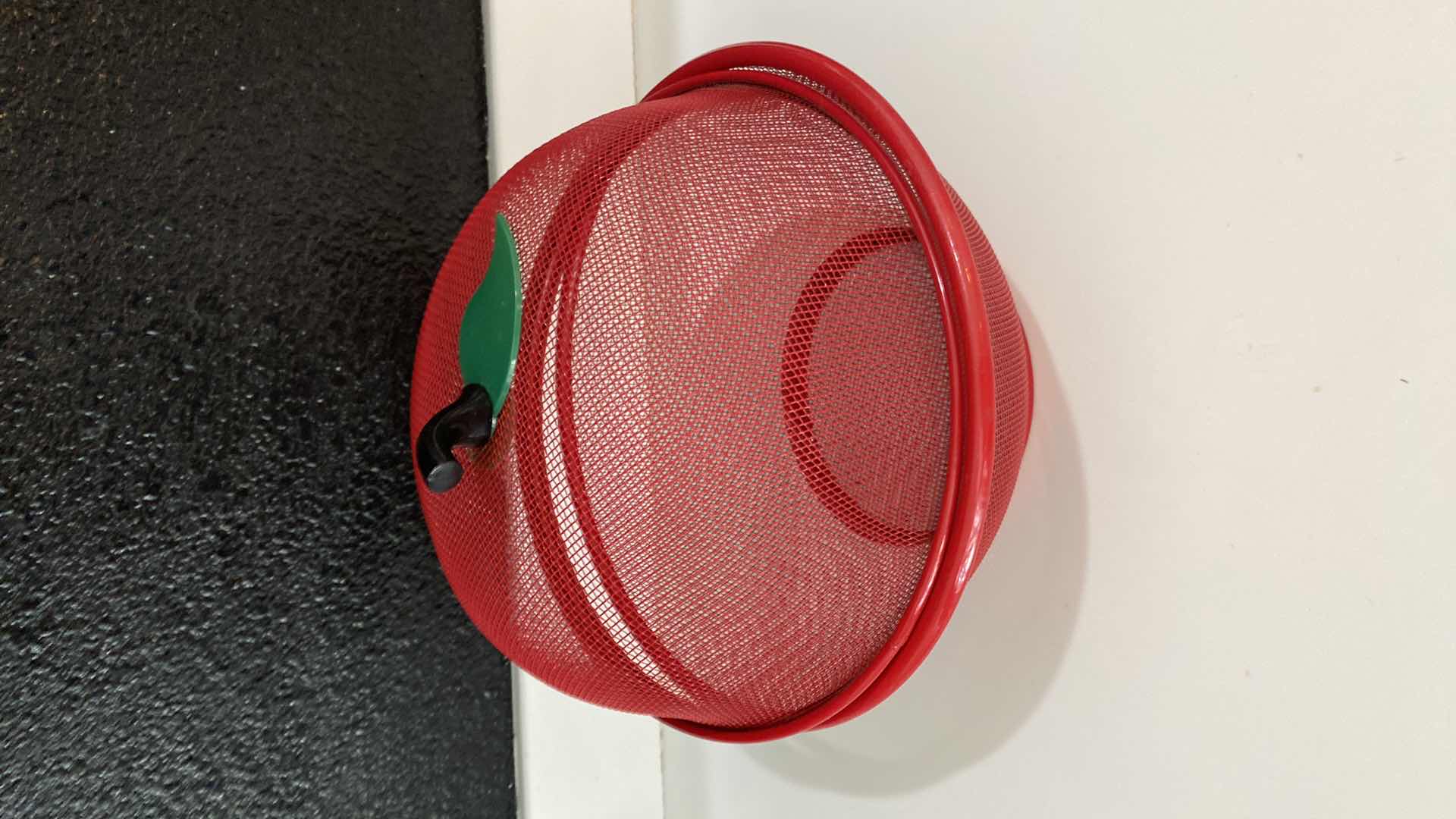 Photo 1 of CONTENTS OF KITCHEN CABINET SHELF - RED CERAMIC BASKET AND MESH BOWL