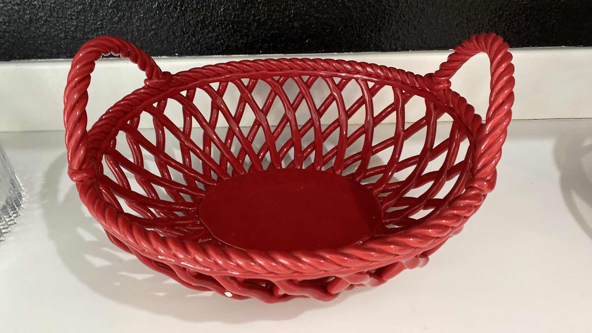 Photo 1 of CONTENTS OF KITCHEN CABINET SHELF - RED CERAMIC BASKET AND MESH BOWL