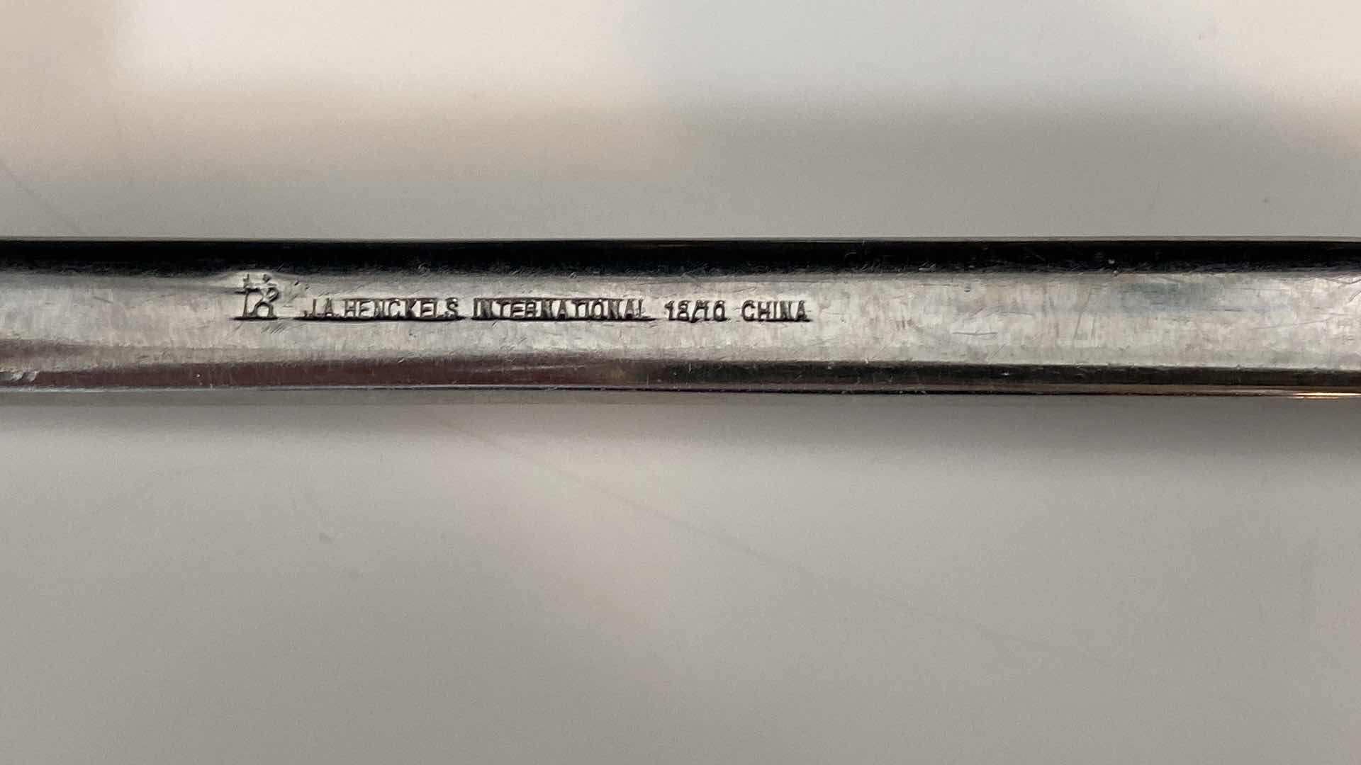 Photo 1 of CONTENTS OF KITCHEN CABINET DRAWER - HENKELS STAINLESS SILVERWARE AND STEAK KNIVES