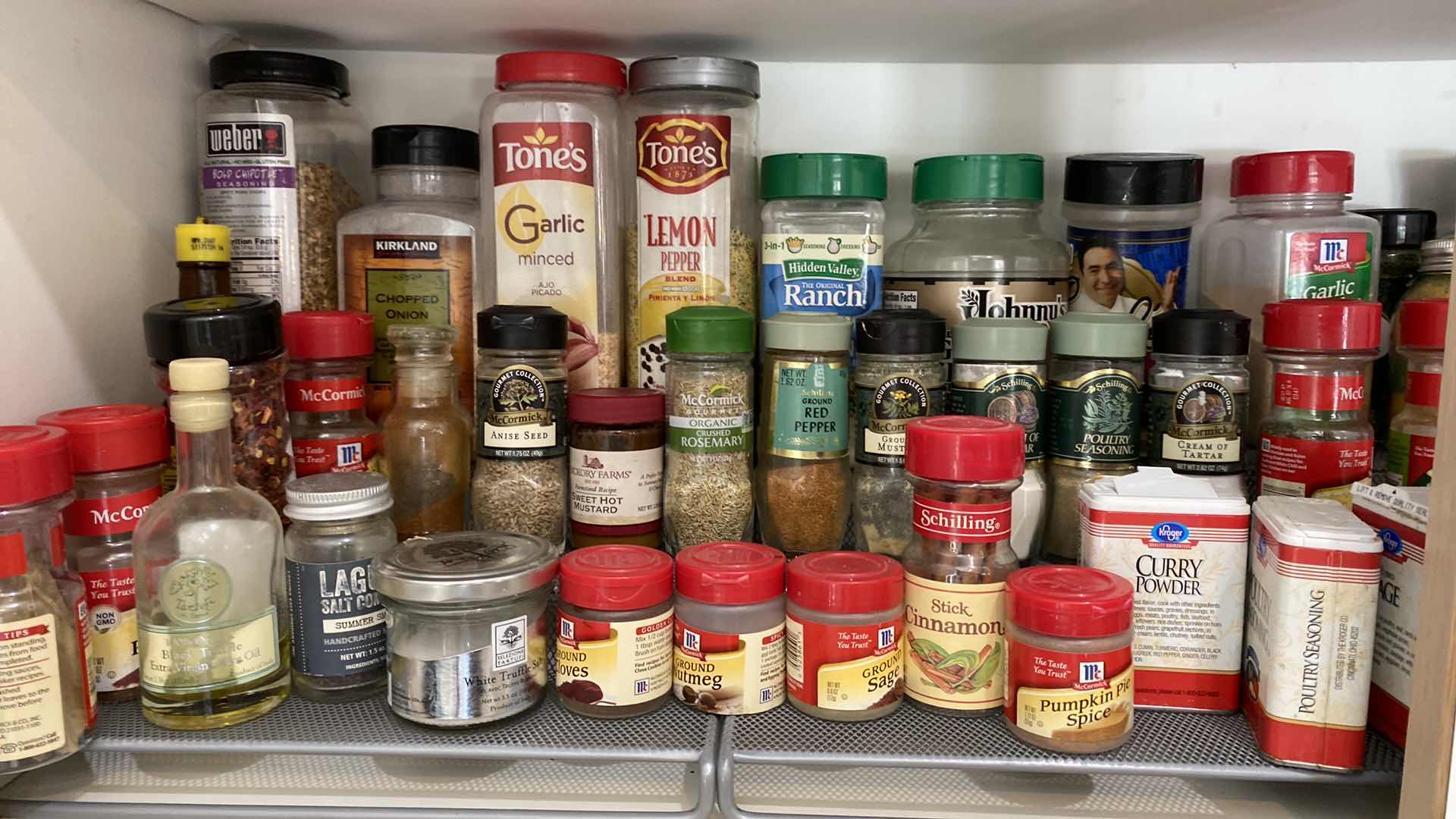 Photo 1 of CONTENTS OF KITCHEN CABINET SPICES AND OILS