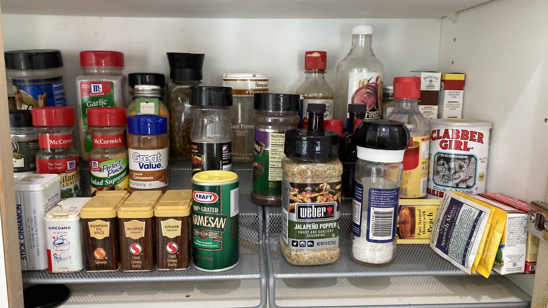 Photo 1 of CONTENTS OF KITCHEN CABINET SPICES AND OILS