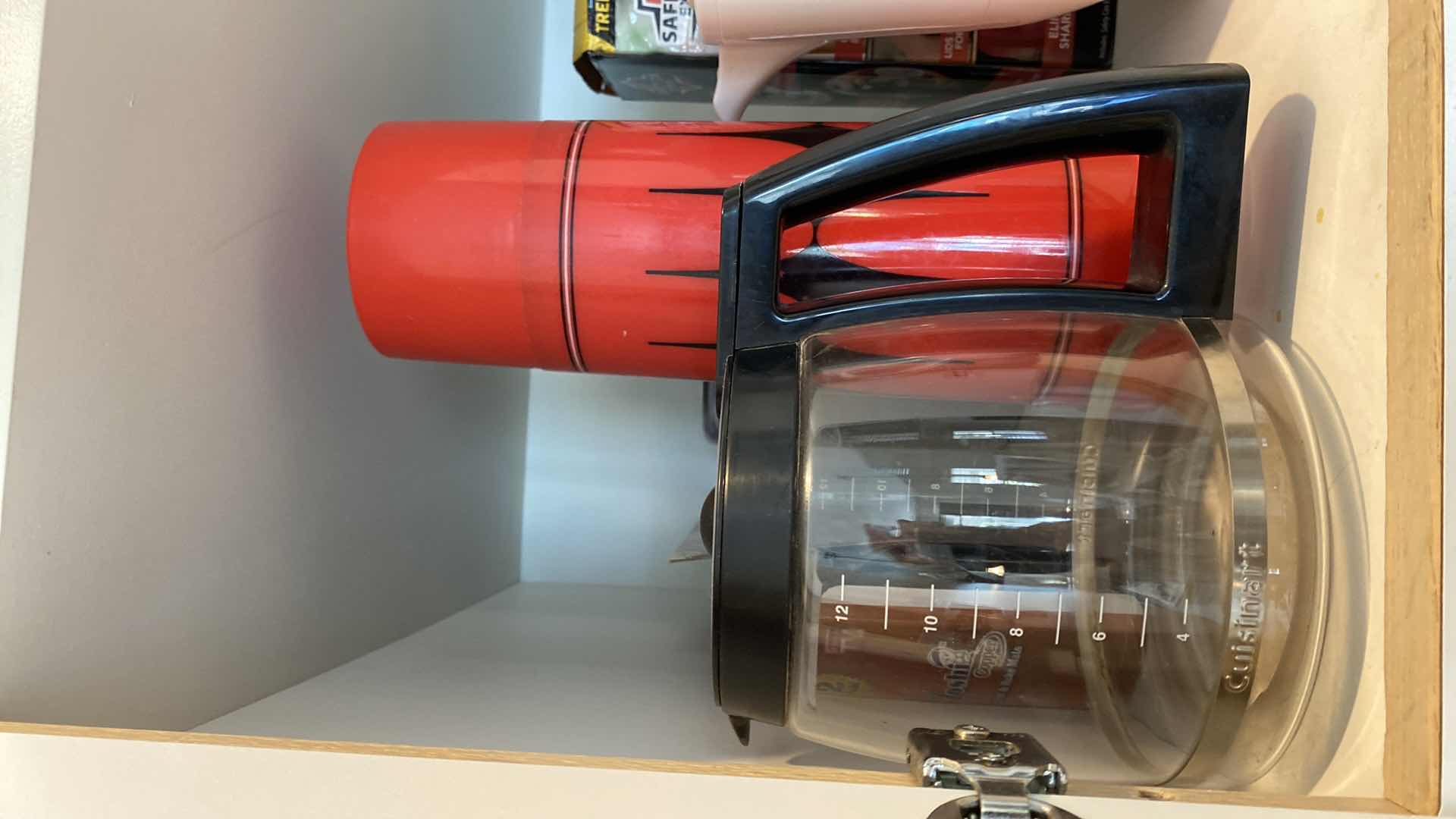 Photo 1 of CONTENTS OF KITCHEN CABINET ABOVE OVEN - GLASS JUICE PITCHERS AND MORE