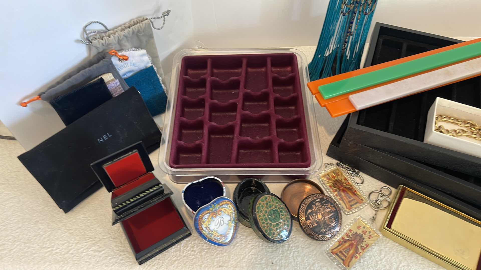 Photo 1 of ASSORTED JEWELRY TRINKET BOXES, BRACELET HOLDER TRAYS, BAGS, KEY CHAINS & FASHION GOLD BRACELET