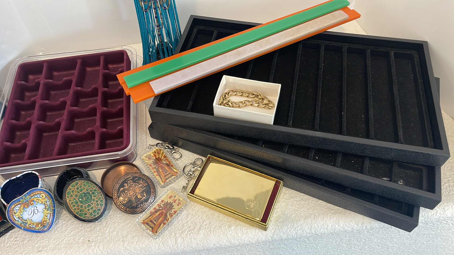 Photo 1 of ASSORTED JEWELRY TRINKET BOXES, BRACELET HOLDER TRAYS, BAGS, KEY CHAINS & FASHION GOLD BRACELET