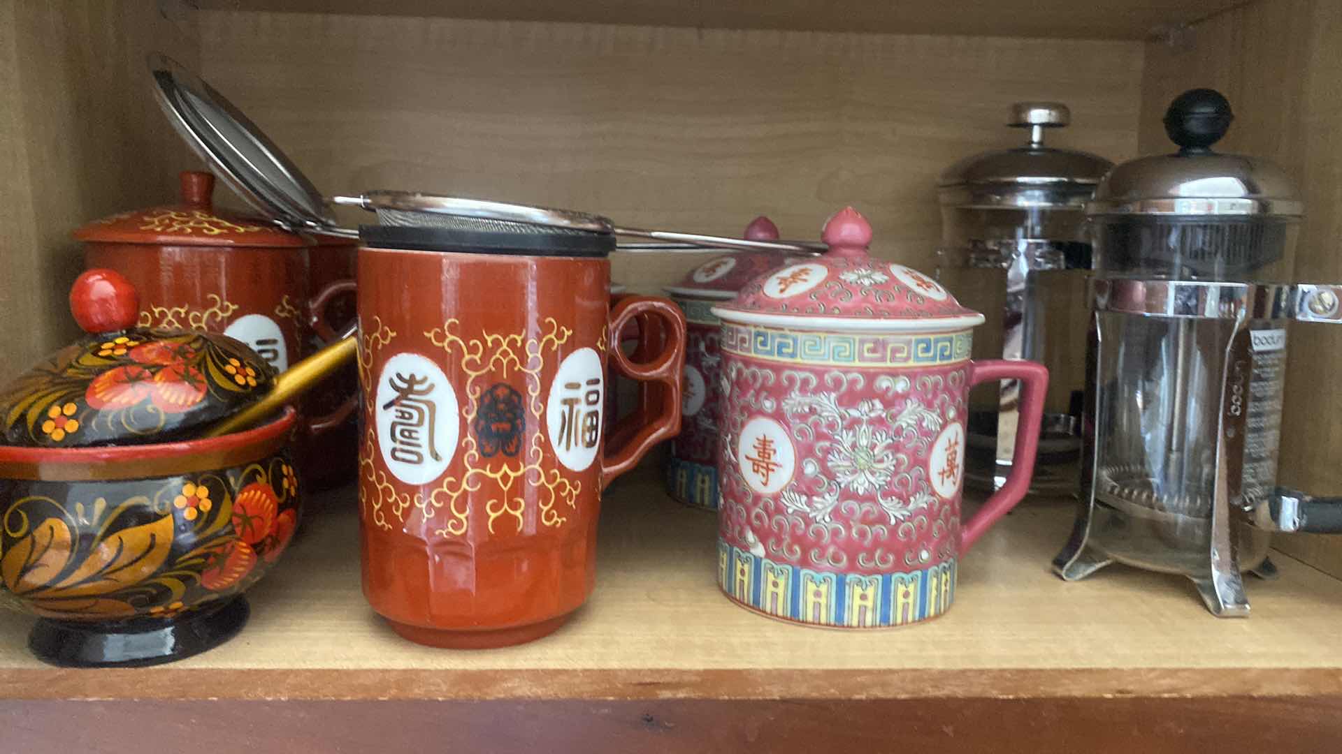 Photo 1 of CONTENTS KITCHEN CABINET- TEA CUPS & INSULATED CUPS