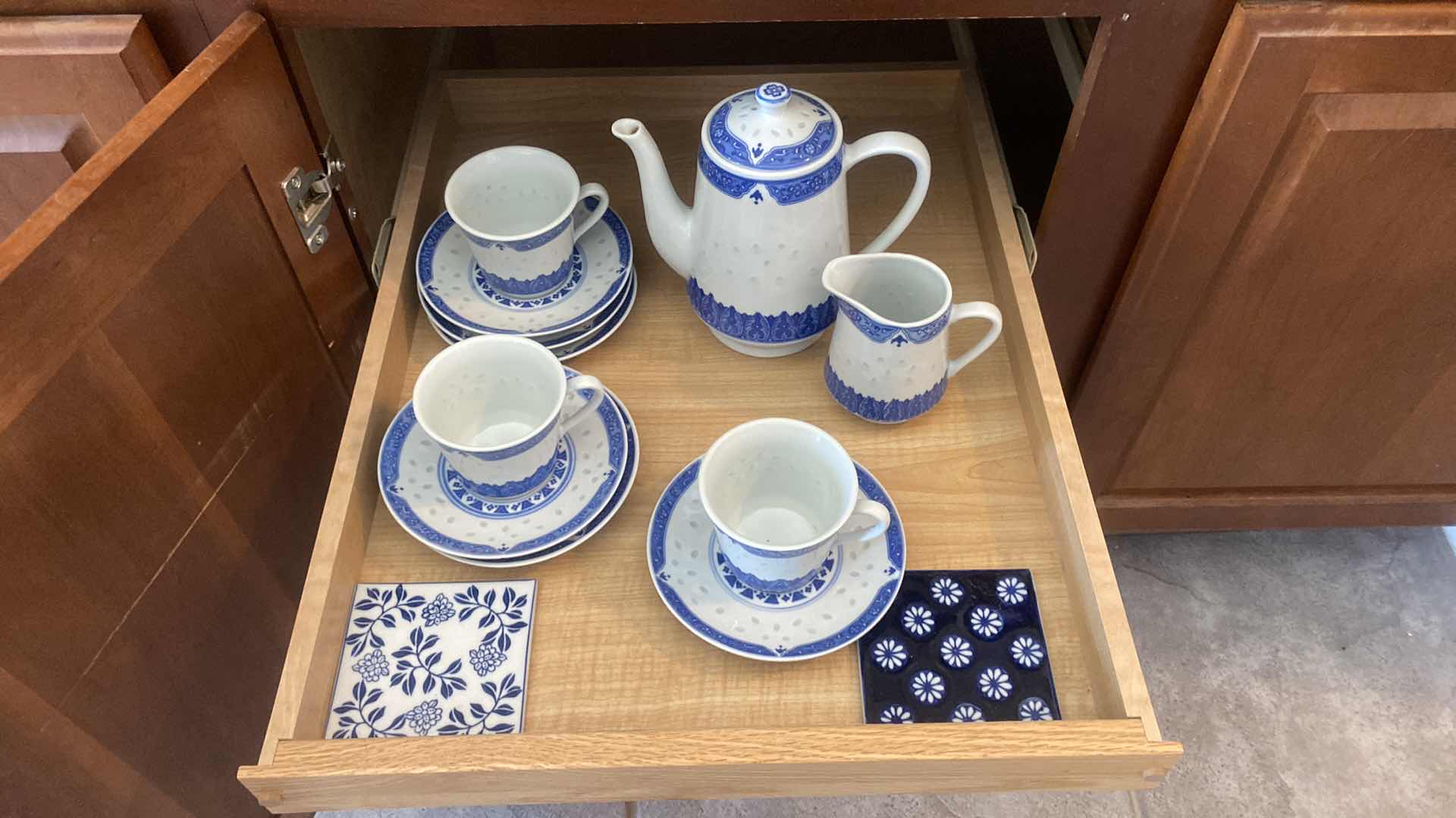 Photo 1 of CONTENTS KITCHEN CABINET- 
TEA  SERVICE