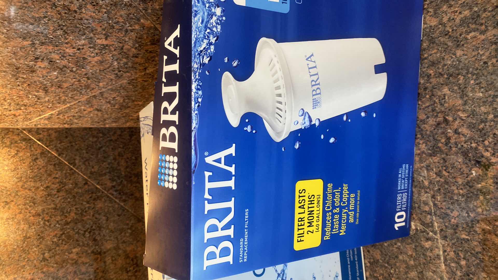 Photo 1 of BRITA & KIRKLAND WATER FILTERS AND PLASTIC TABLECLOTHS