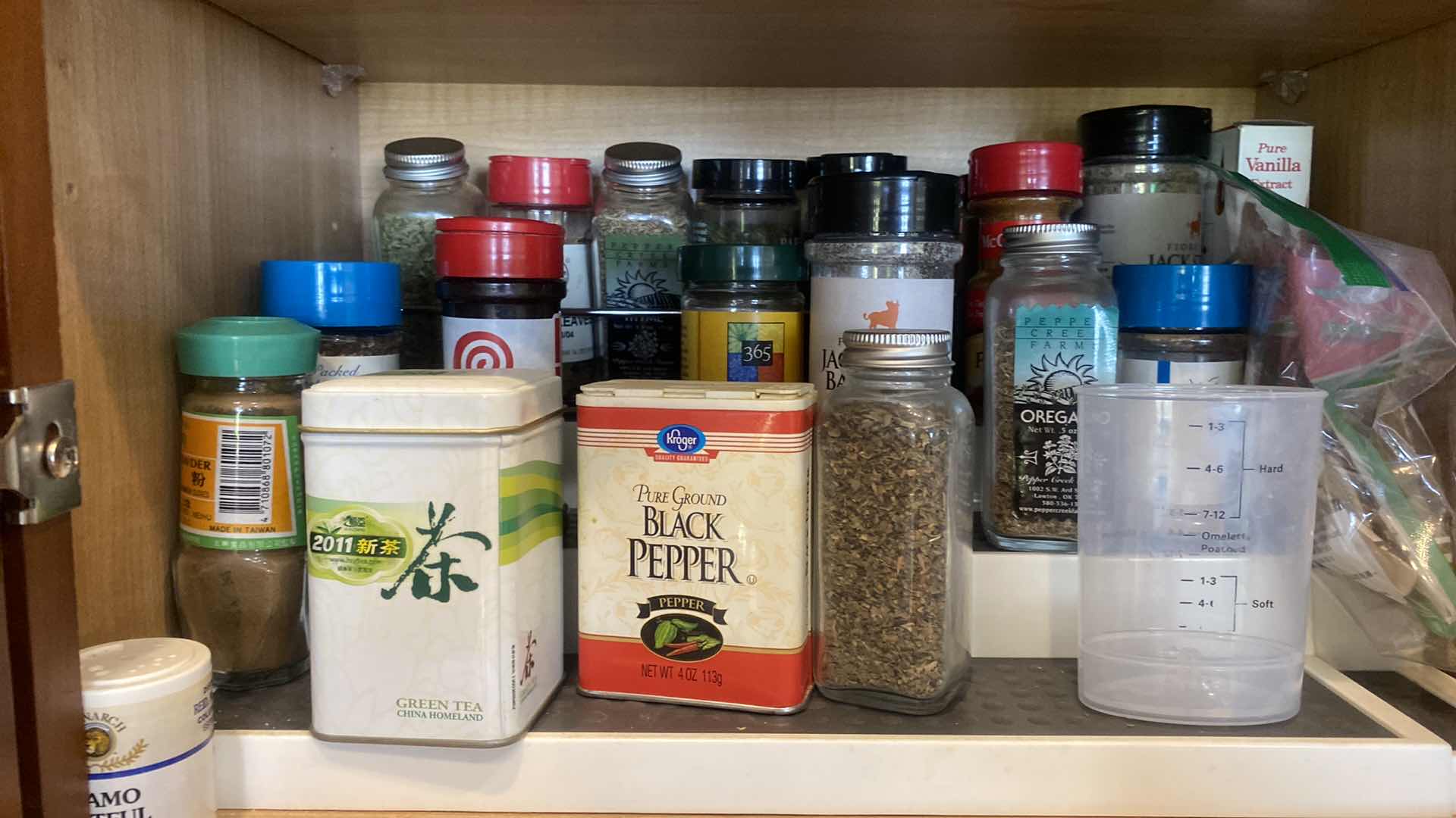 Photo 1 of CONTENTS OF KITCHEN CABINET - SPICES AND CANISTERS