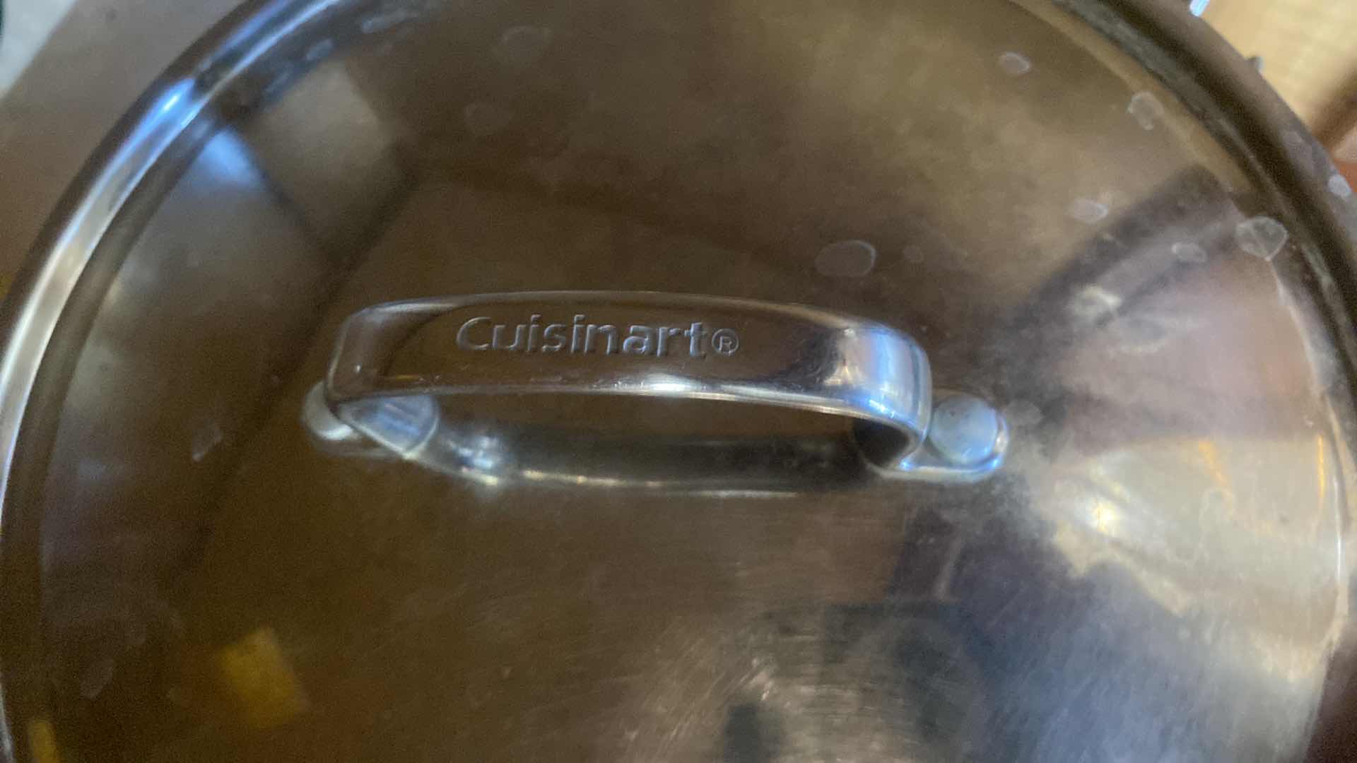 Photo 1 of CONTENTS OF KITCHEN CABINET - CUISINART PAN WITH LID AND A WOK