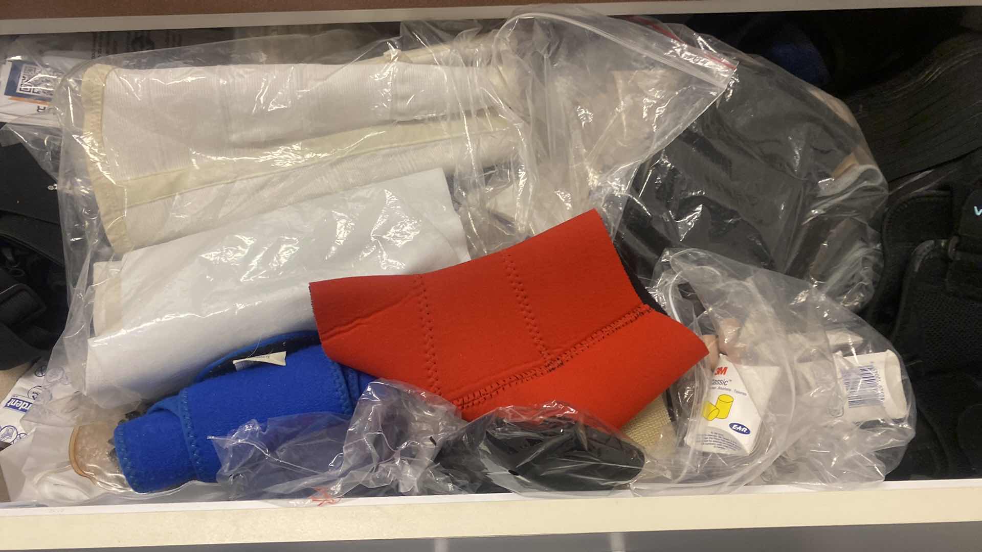 Photo 1 of CONTENTS LAUNDRY ROOM CABINET - DRAWER OF KNEE BRACES