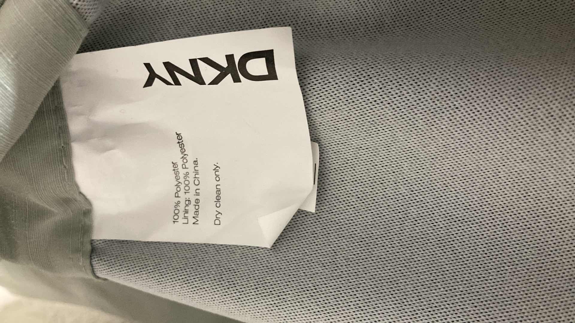 Photo 1 of DKNY POLYESTER DUAL LAYER CURTAIN PANELS (2) 50” X 84” W ADJUSTABLE METAL CURTAIN ROD