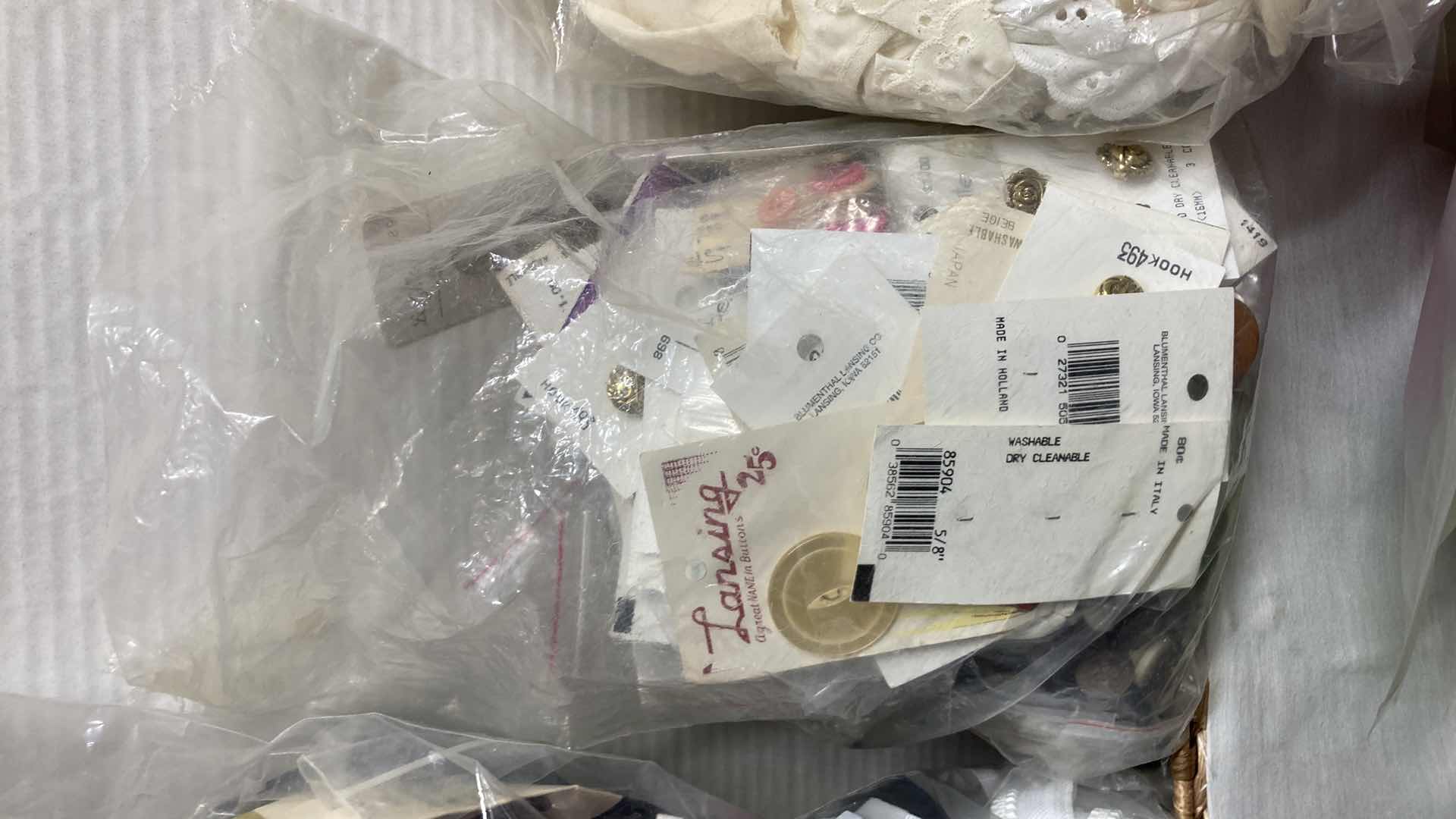 Photo 1 of FABRIC ZIPPERS, BUTTONS, REMNANTS & ACCESSORIES W WICKER BASKET 21” X 12” H7”