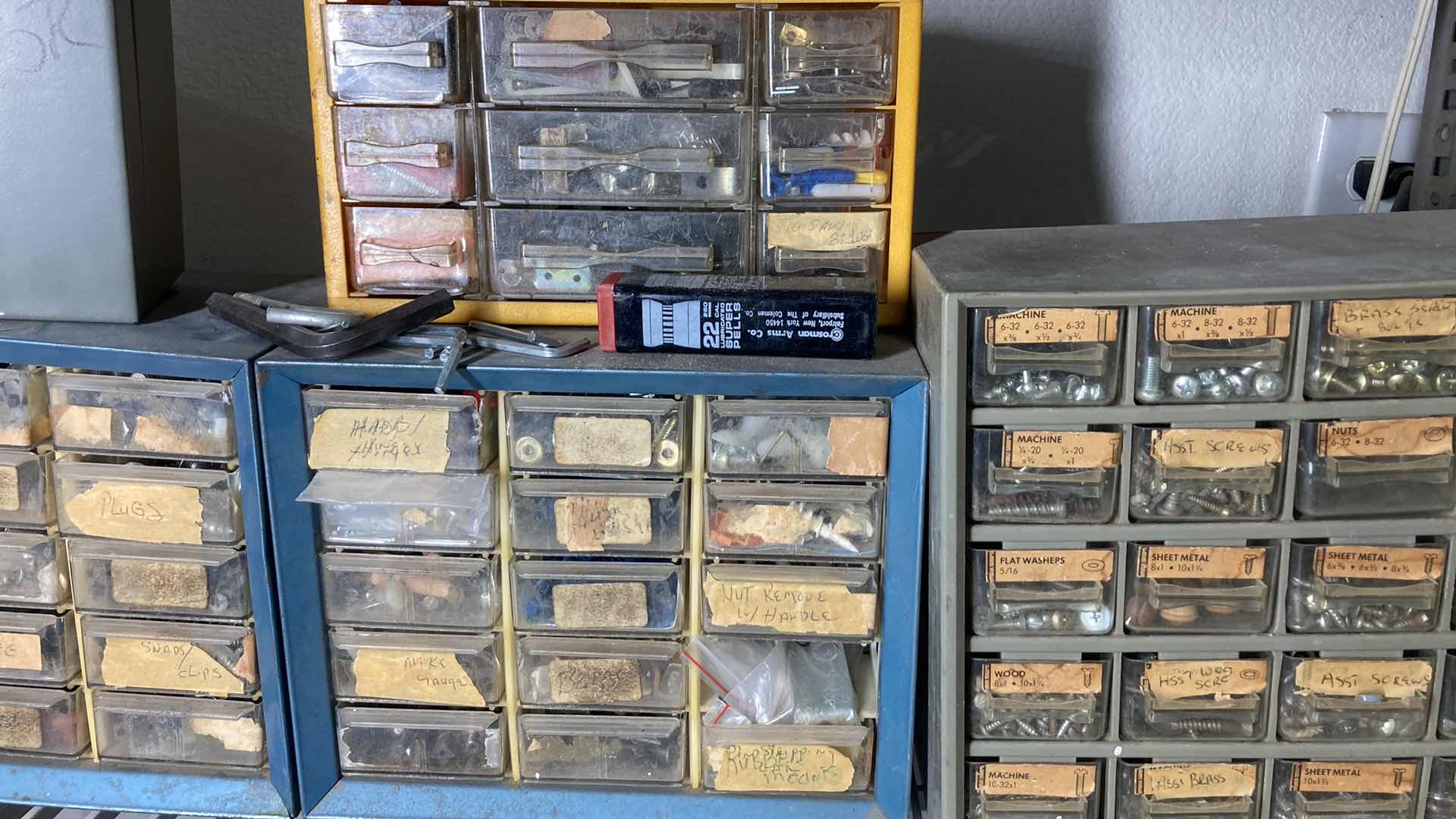 Photo 3 of CONTENTS OF SHELF-HARDWARE STORAGE CONTAINERS (4) W MULTIPURPOSE SAND PAPER