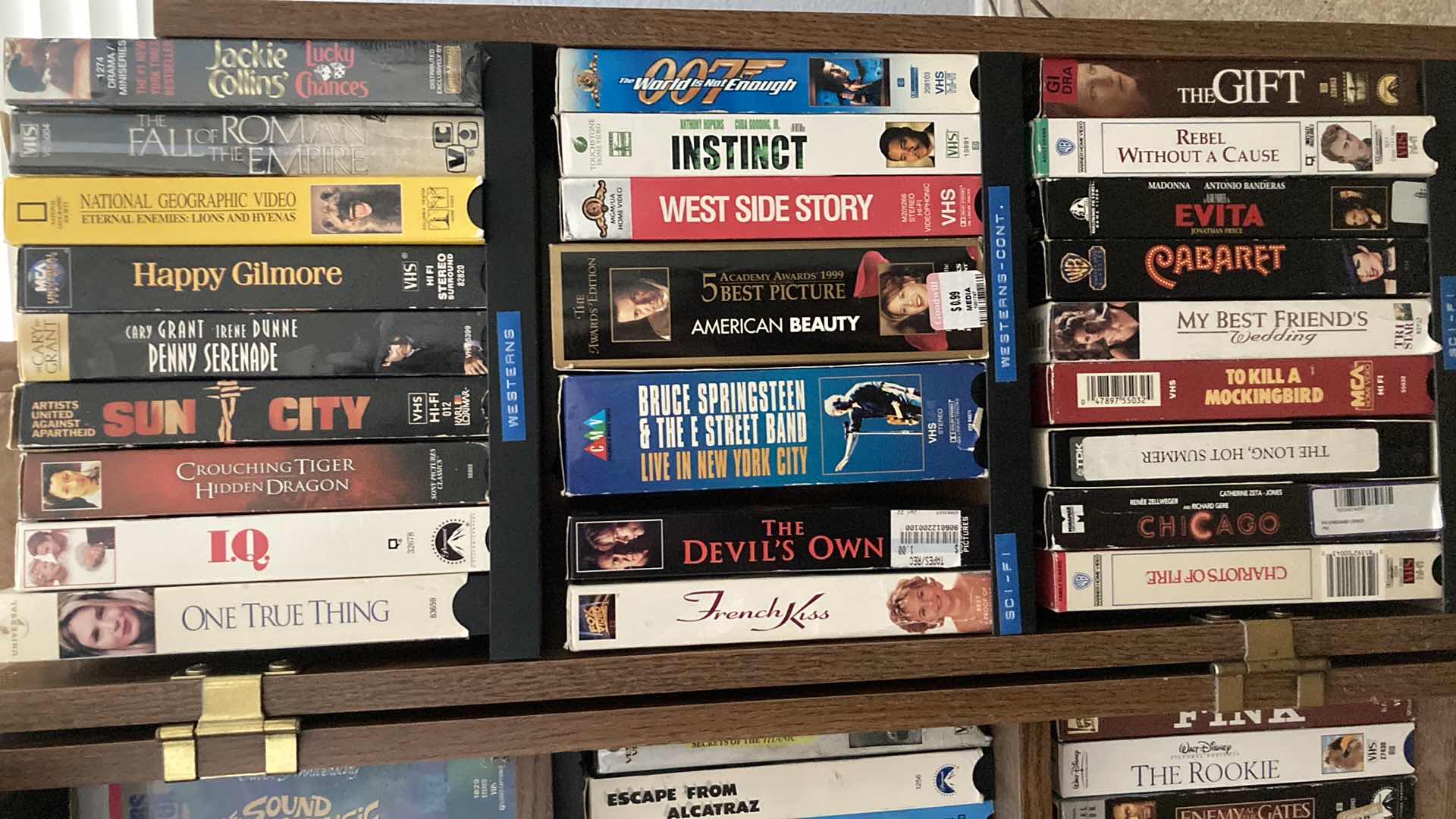 Photo 1 of VHS MOVIES-VARIOUS GENRES W ROLLING VHS STORAGE CABINET 23” X 30” H29.5”