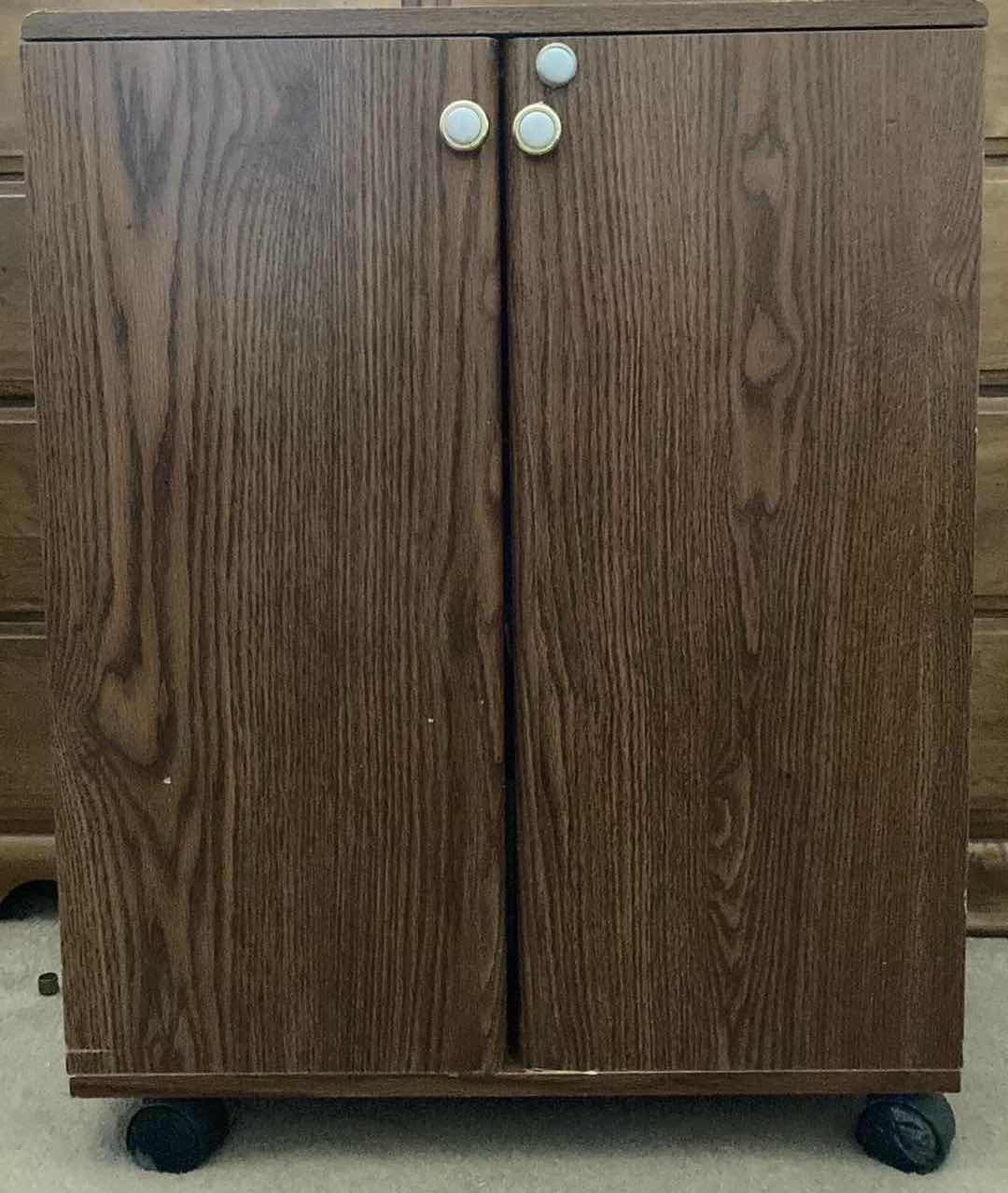 Photo 1 of VHS MOVIES-VARIOUS GENRES W ROLLING VHS STORAGE CABINET 23” X 30” H29.5”