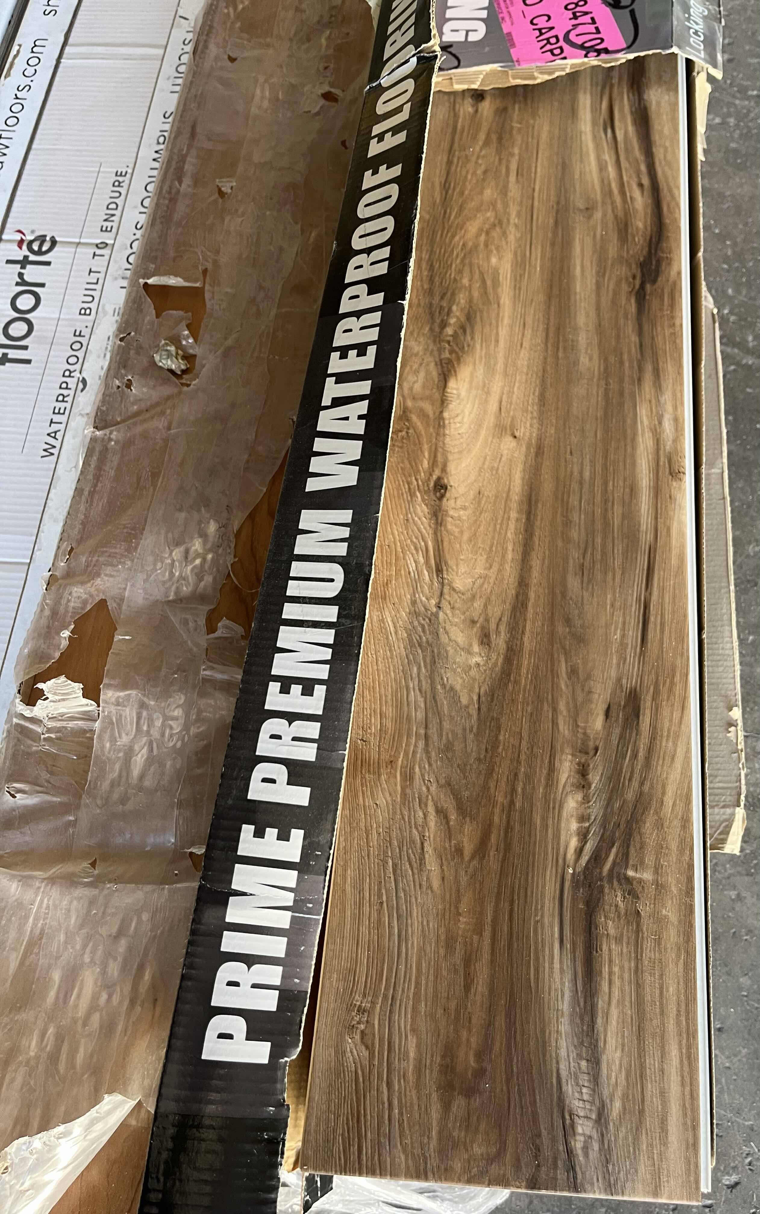 Photo 1 of MIXED FLOORING PALLET- VINYL & HARDWOOD PANEL FLOORING (7 BOXES)