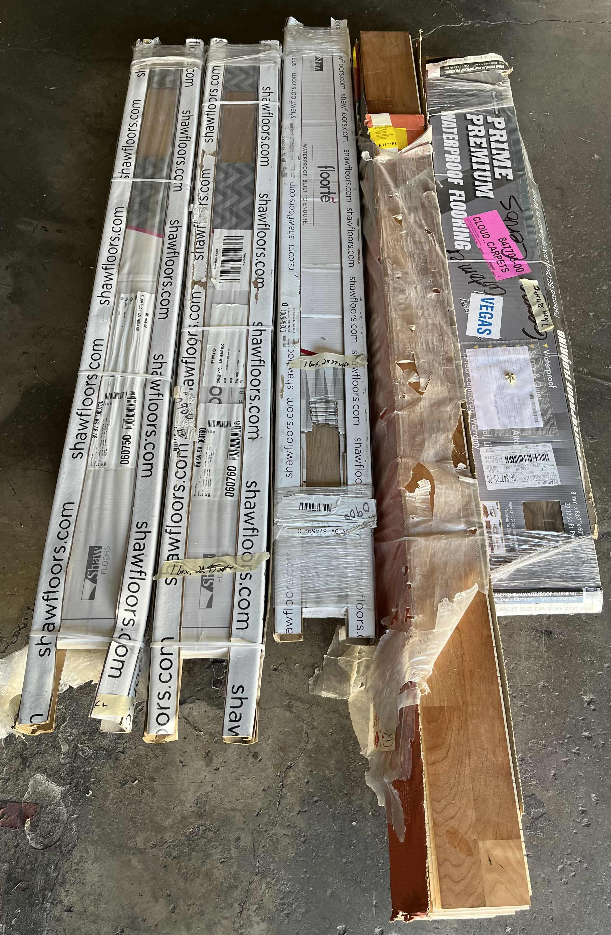 Photo 1 of MIXED FLOORING PALLET- VINYL & HARDWOOD PANEL FLOORING (7 BOXES)