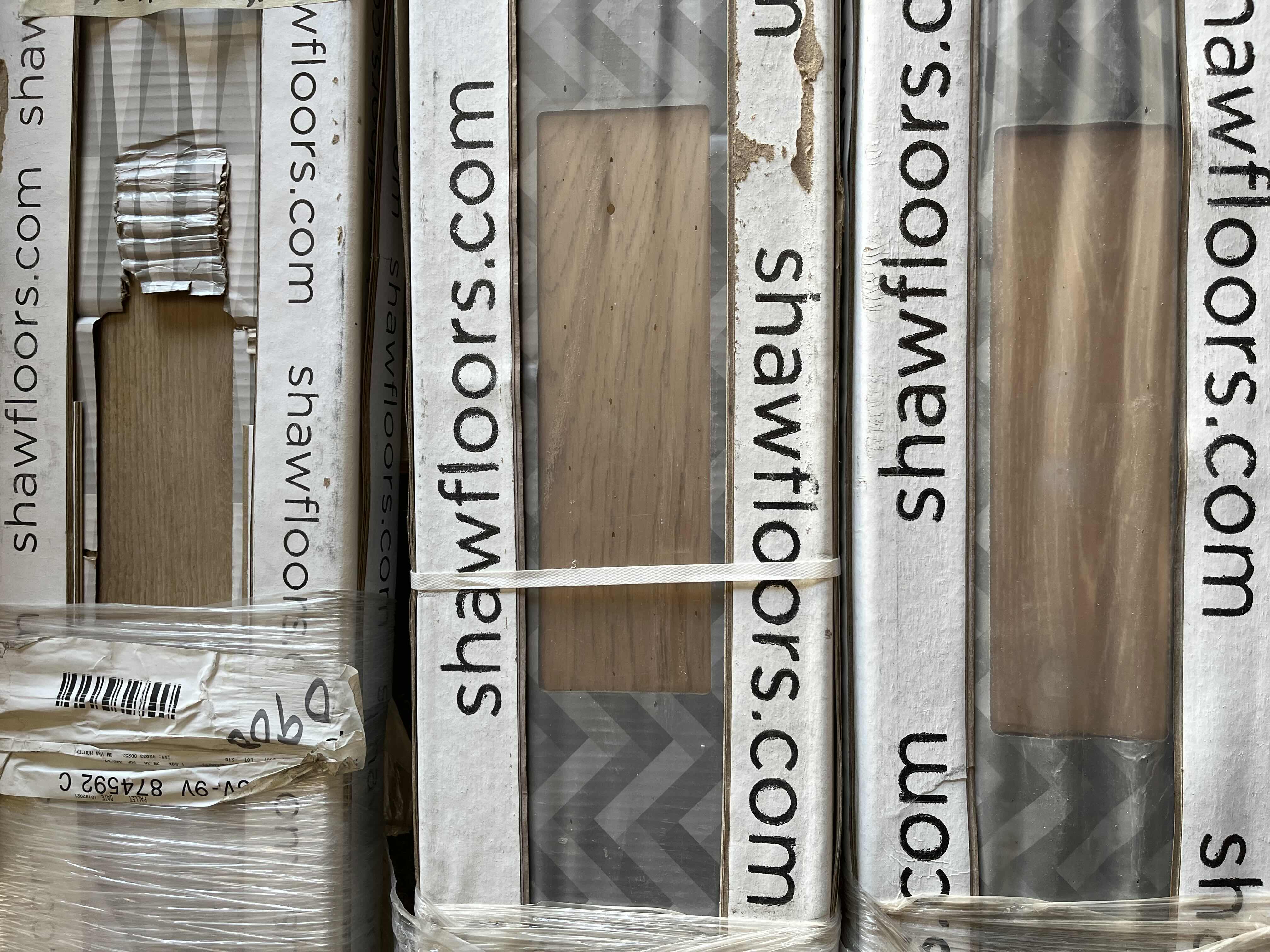 Photo 1 of MIXED FLOORING PALLET- VINYL & HARDWOOD PANEL FLOORING (7 BOXES)