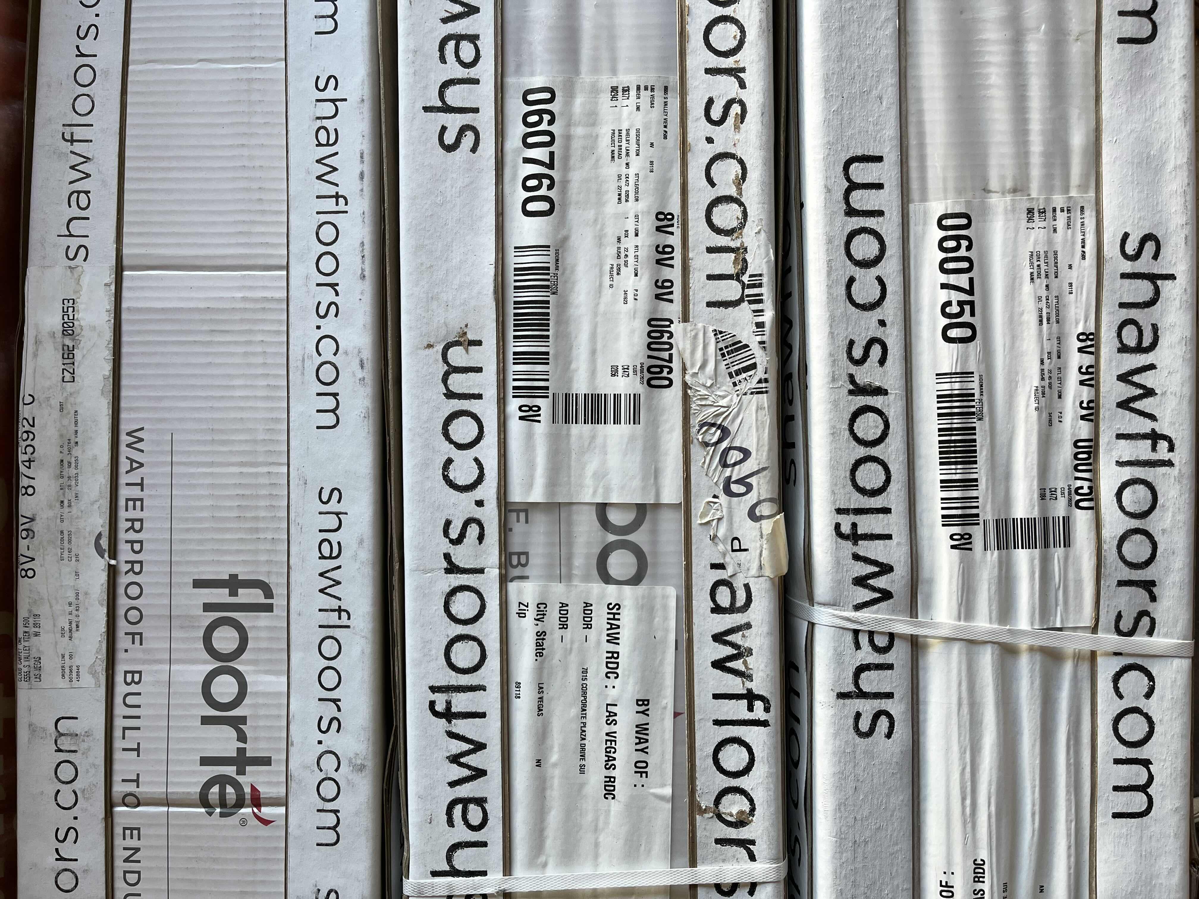 Photo 1 of MIXED FLOORING PALLET- VINYL & HARDWOOD PANEL FLOORING (7 BOXES)