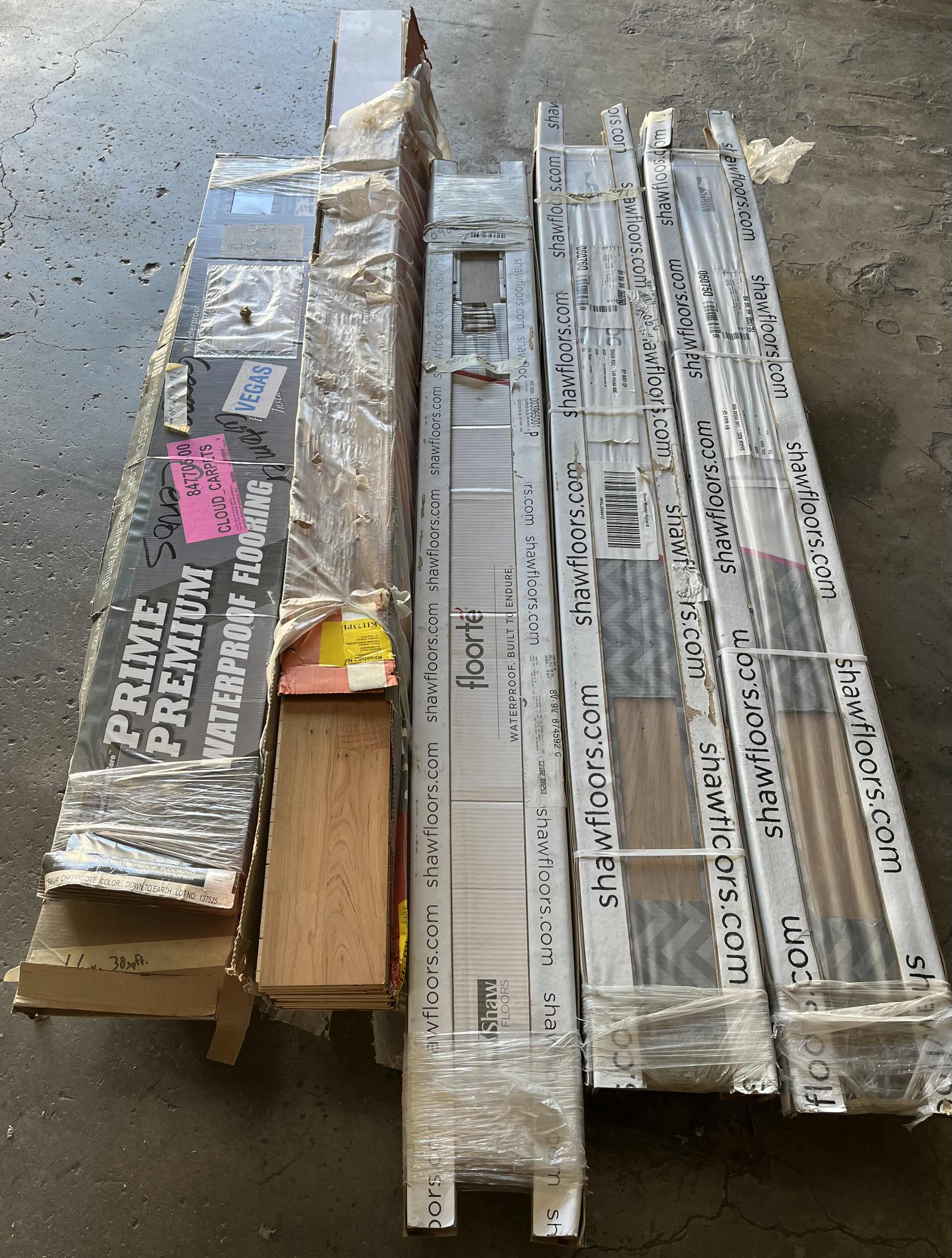 Photo 1 of MIXED FLOORING PALLET- VINYL & HARDWOOD PANEL FLOORING (7 BOXES)