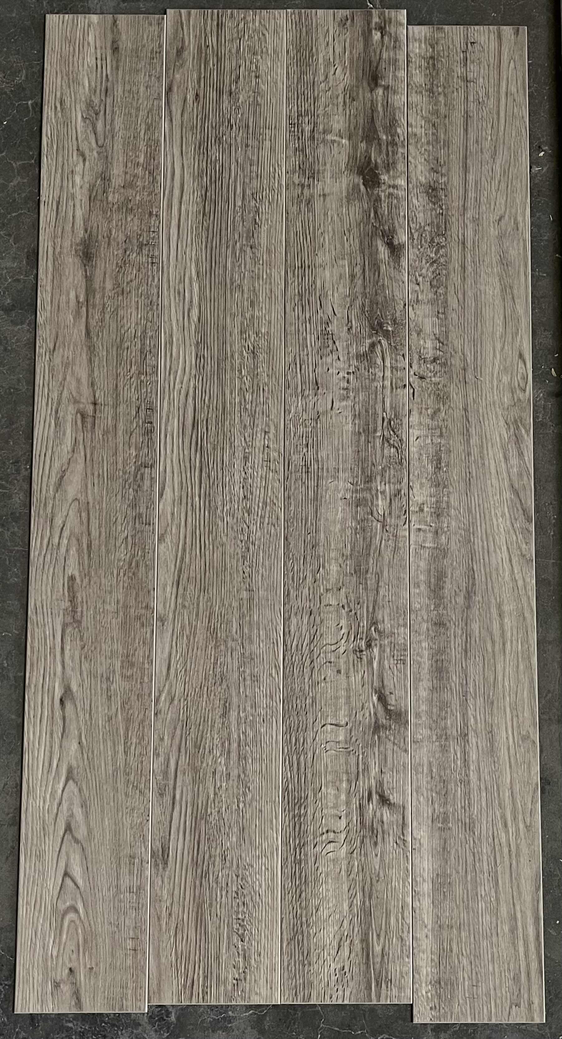 Photo 1 of PREMIUM LUXURY VINYL TILE GRAY WOODGRAIN FINISH GLUE DOWN VINYL PLANK FLOORING 5” X 48” (36SQFT PER CASE/2CASES APPROX. 72SQFT TOTAL) READ NOTES