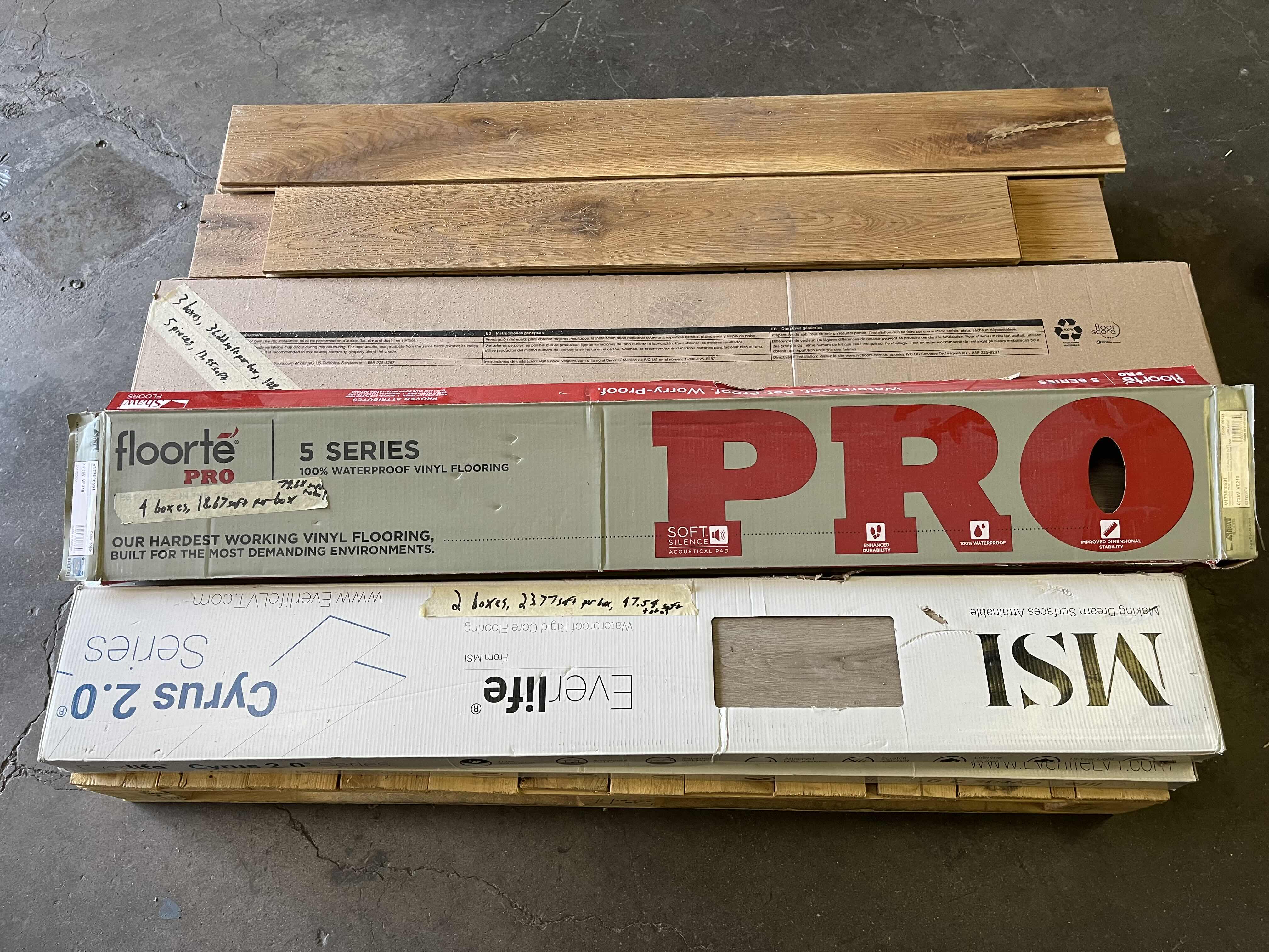 Photo 1 of MIXED FLOORING PALLET-GLUE DOWN/SNAP IN VINYL & HARDWOOD PLANK FLOORING - VARIOUS SIZES & STYLES (READ NOTES)