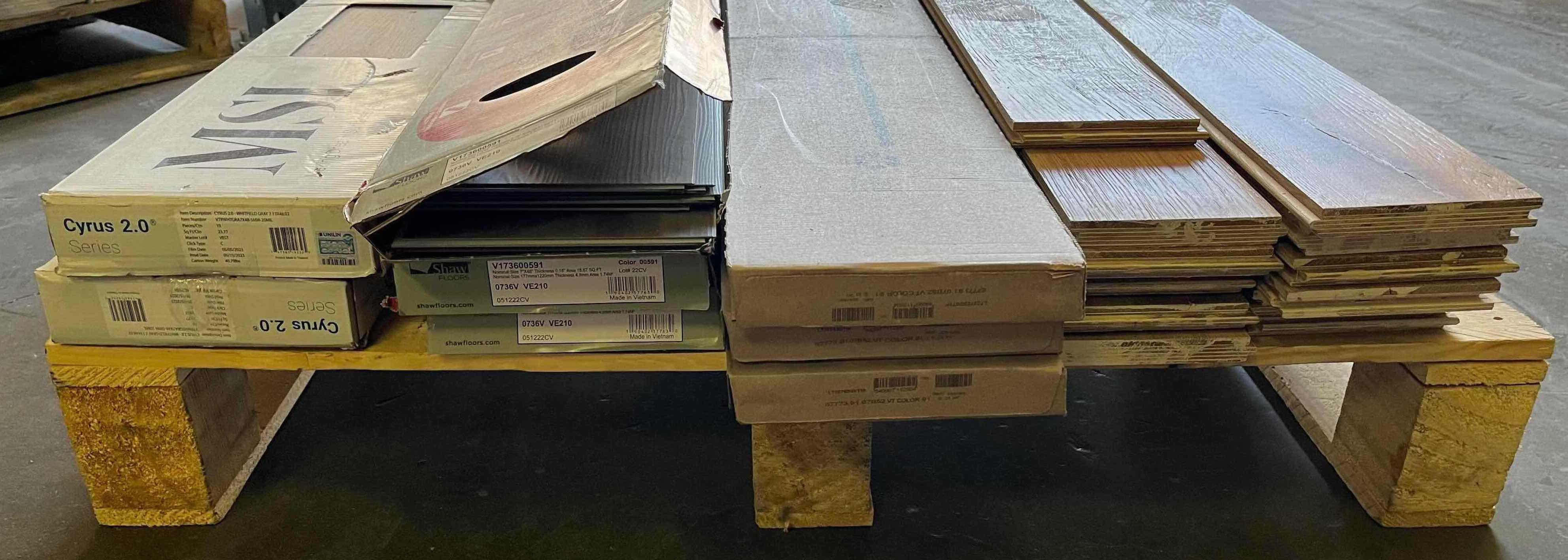 Photo 1 of MIXED FLOORING PALLET-GLUE DOWN/SNAP IN VINYL & HARDWOOD PLANK FLOORING - VARIOUS SIZES & STYLES (READ NOTES)