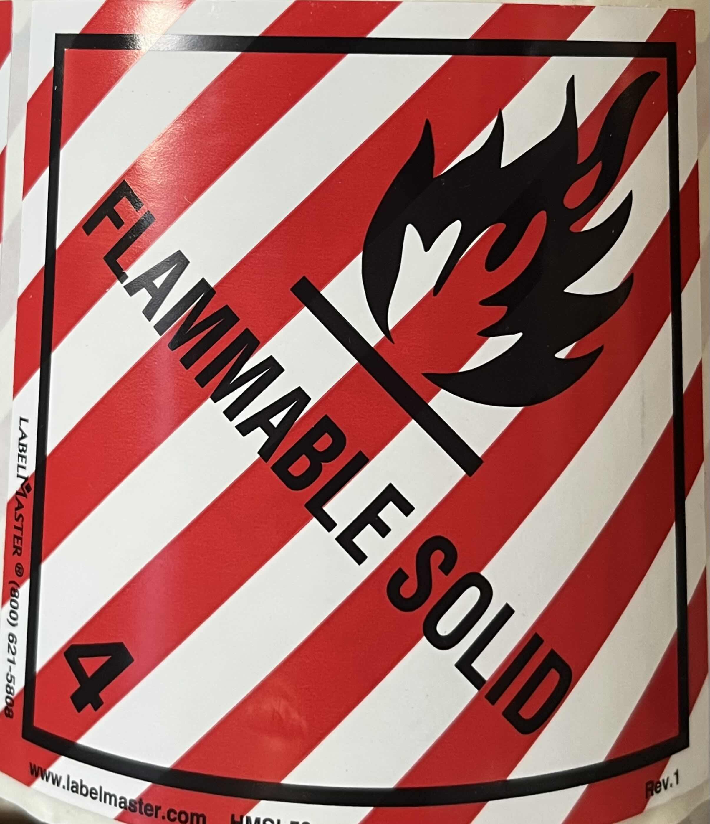 Photo 1 of LABEL MASTER HAZARD CLASS 4 FLAMMABLE SOLID DOT/SHIPPING 500CT 4” ADHESIVE LABEL ROLL HMSL50