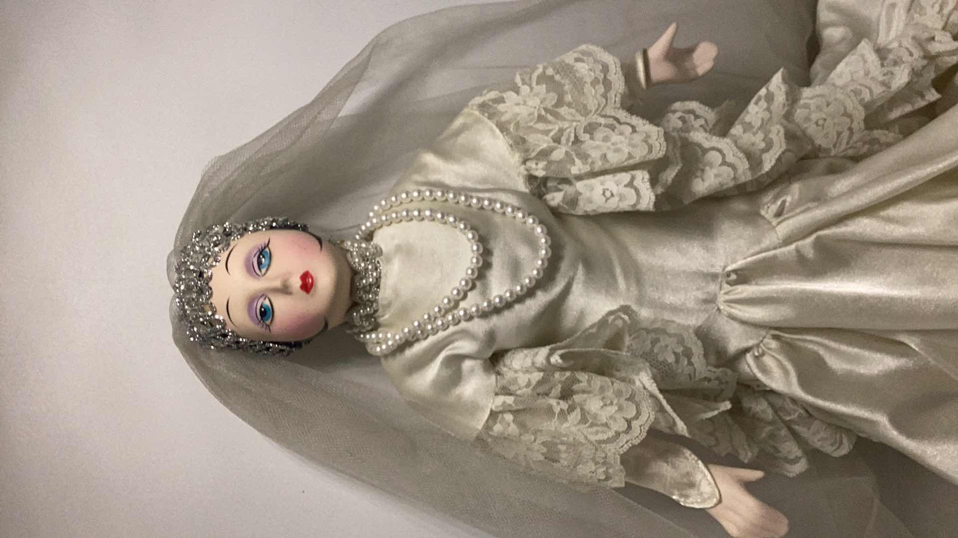 Photo 2 of COLLECTIBLE PORCELAIN DOLL H17”