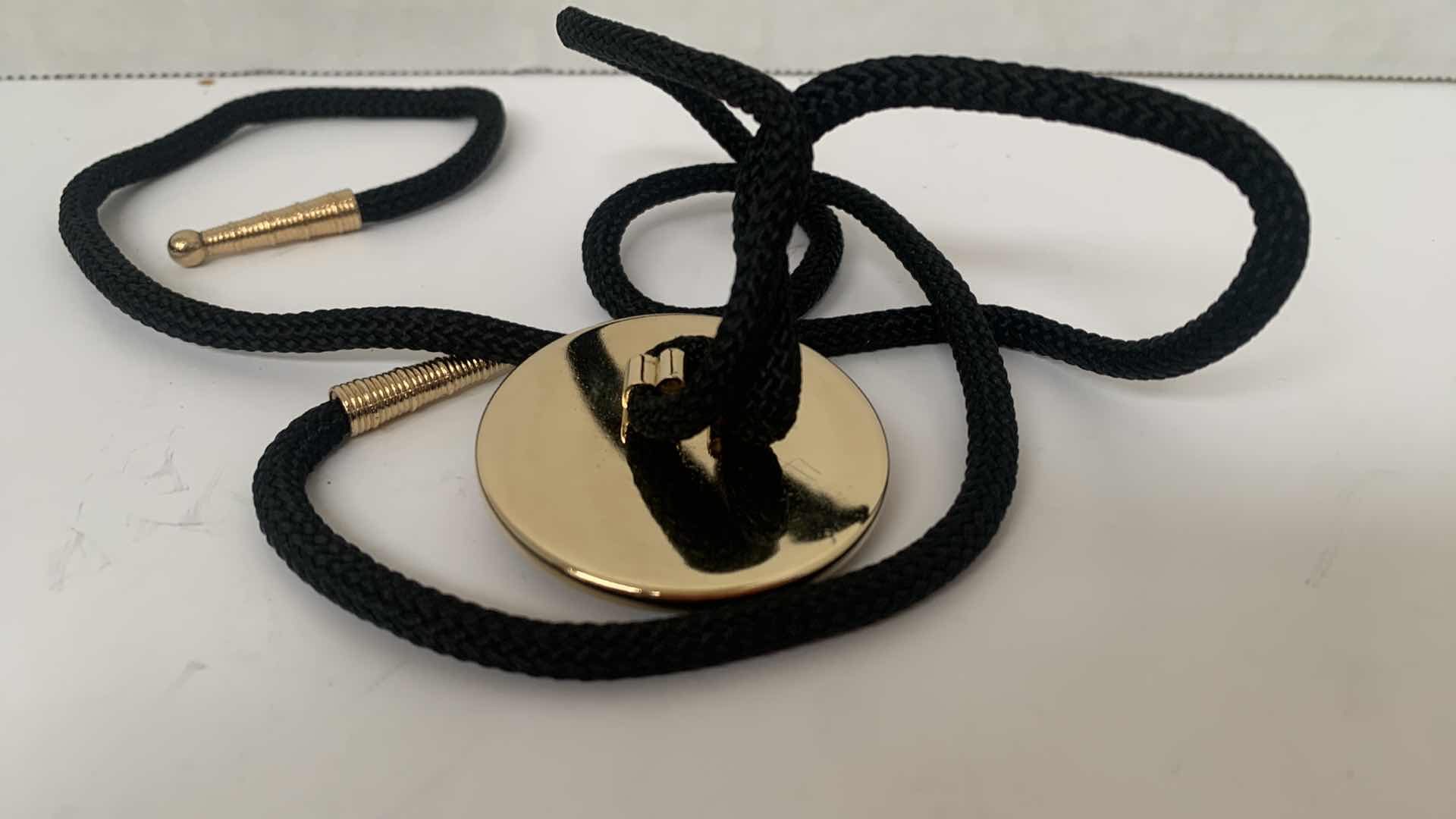 Photo 1 of $100 CASINO TOKEN ON LANYARD, SILVER BIRD