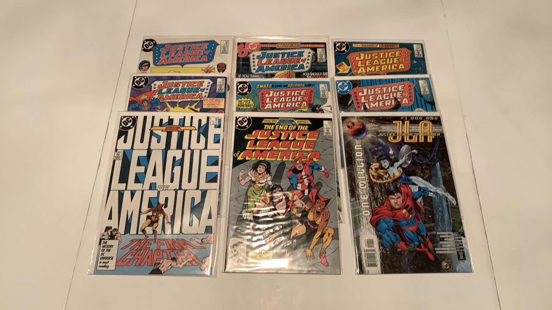 Photo 1 of 9- JUSTICE LEAGUE COMICS