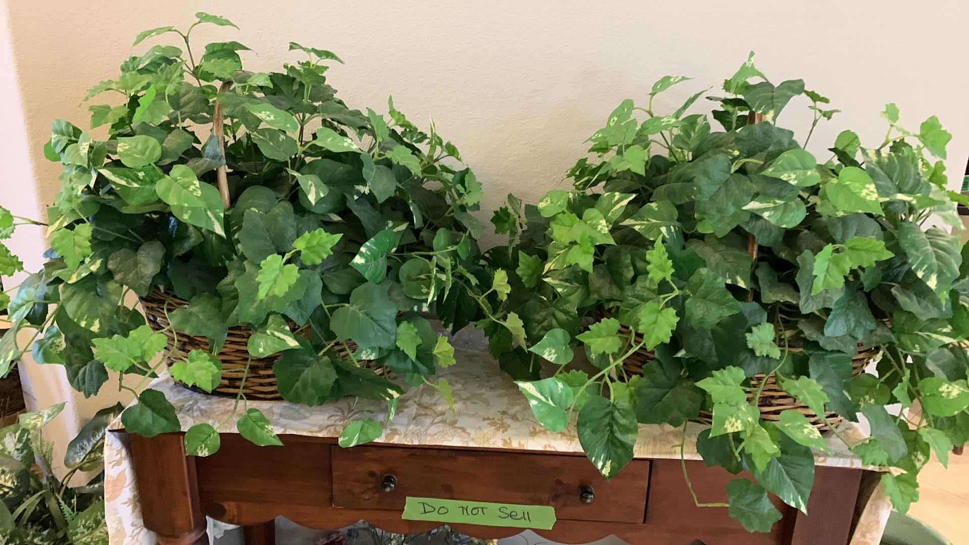 Photo 1 of HOME DECOR, TWO LARGE WICKER BASKETS WITH FAUX GREENERY 29” x H19”