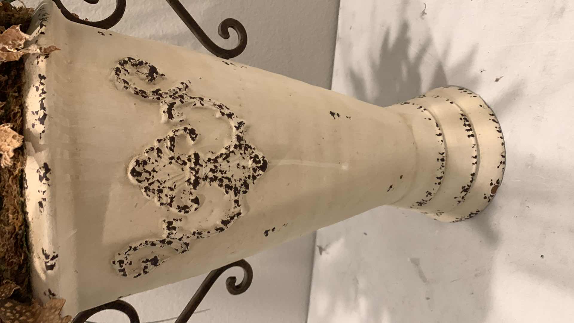 Photo 1 of TALL, PURPOSELY AGED METAL URN W FAUX FLOWER ARRANGEMENT