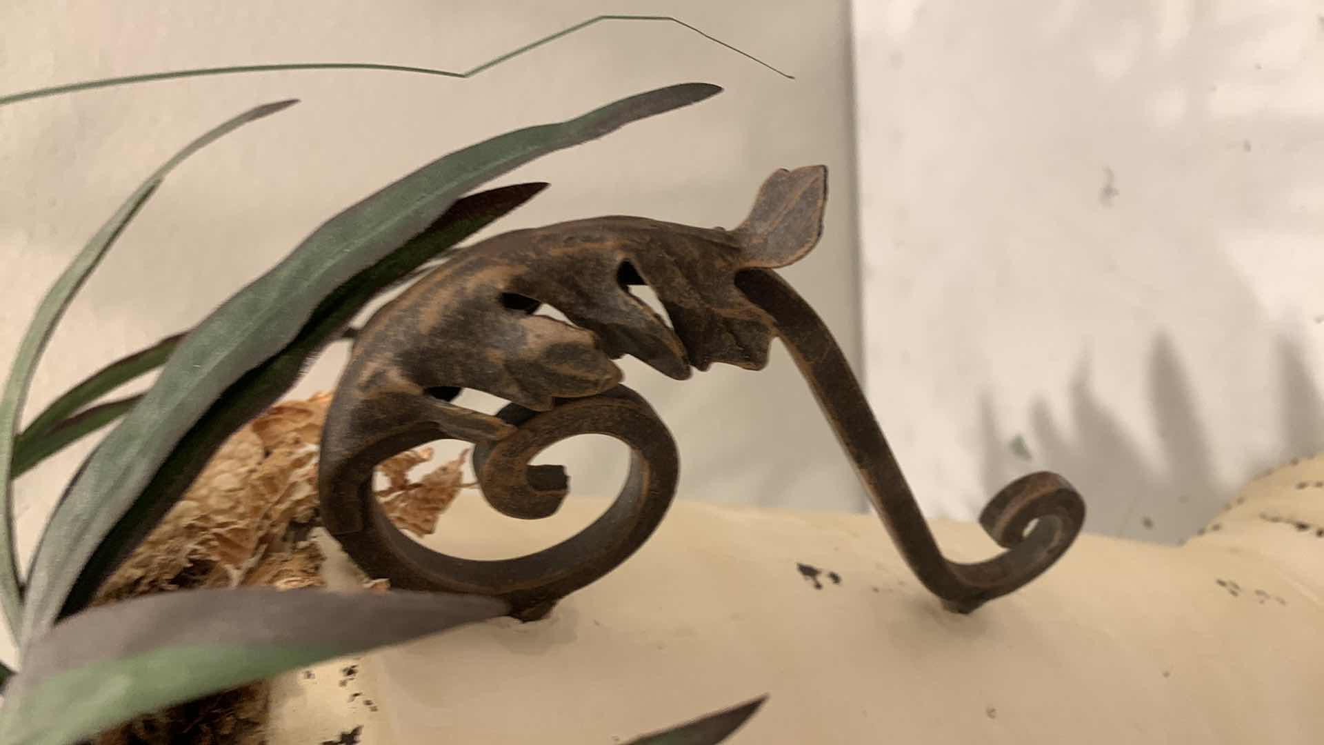 Photo 1 of TALL, PURPOSELY AGED METAL URN W FAUX FLOWER ARRANGEMENT