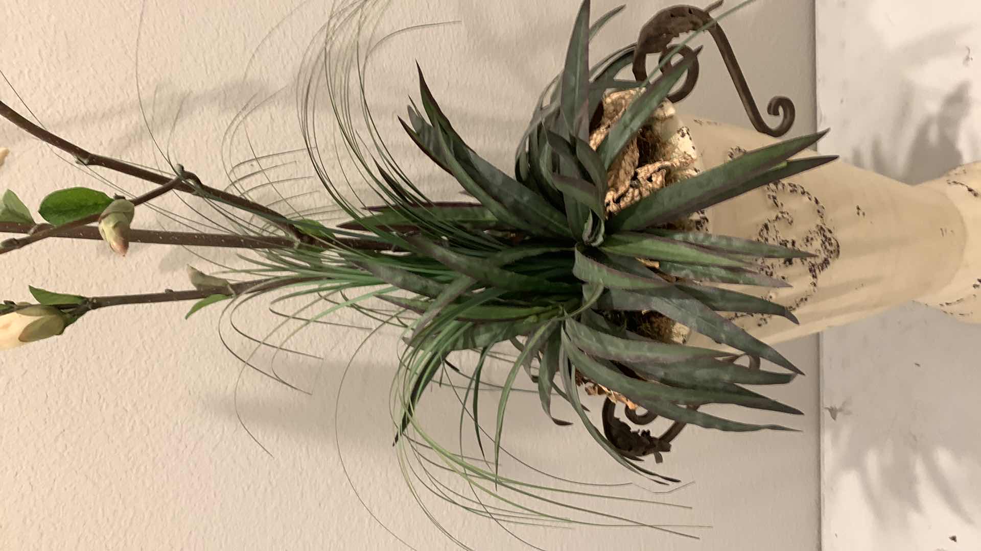 Photo 1 of TALL, PURPOSELY AGED METAL URN W FAUX FLOWER ARRANGEMENT