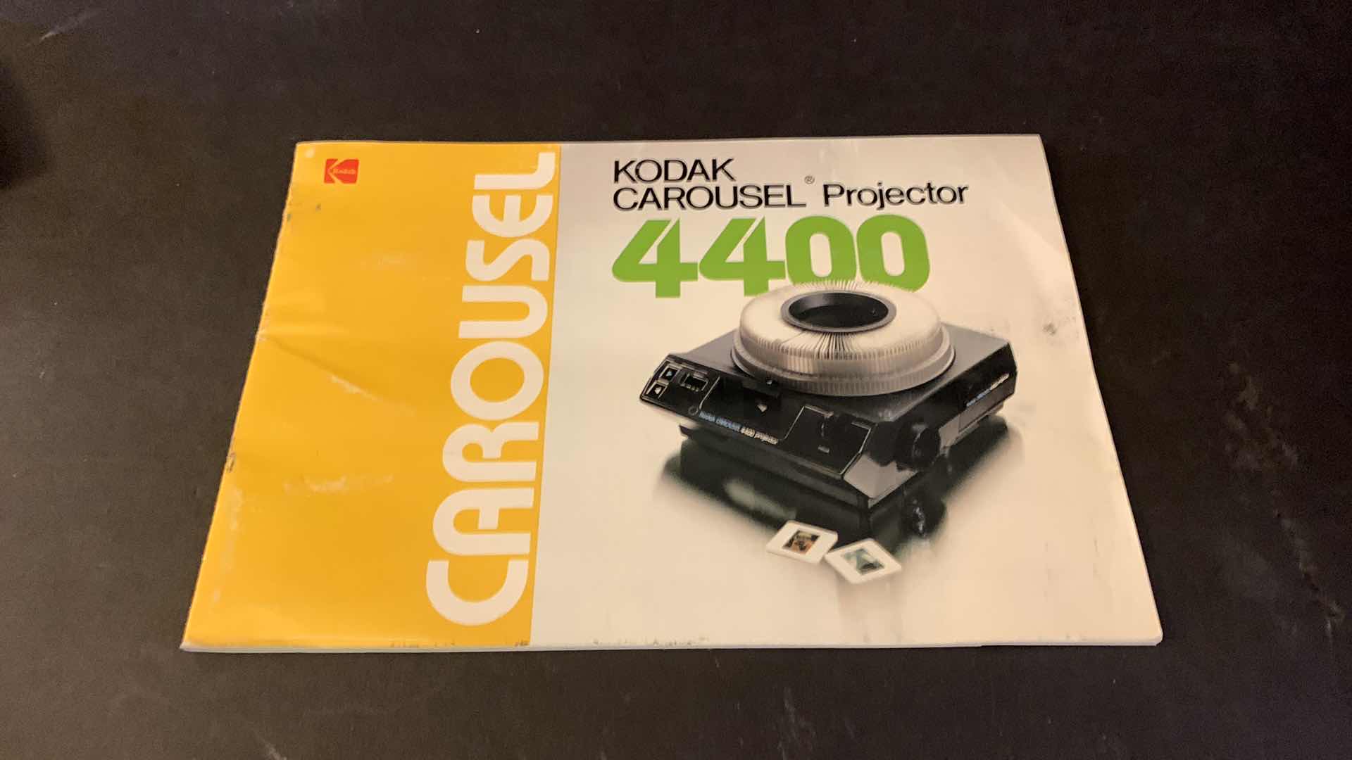 Photo 1 of KODAK CAROUSEL PROJECTOR 4400 IN ORIGINAL LEATHER CASE W ACCESSORIES, 4 BOXES SLIDE TRAYS