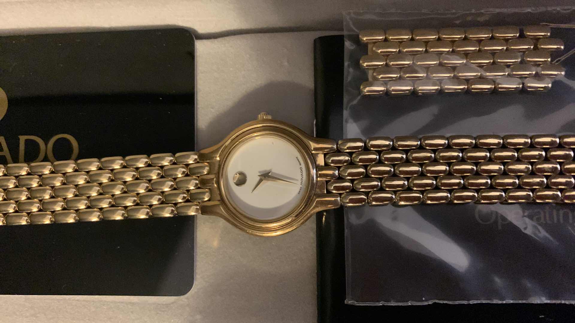 Photo 1 of WOMENS GOLD MOVADO WATCH W BOX, CASE, LINKS, AND RECEIPT $550 in 1990