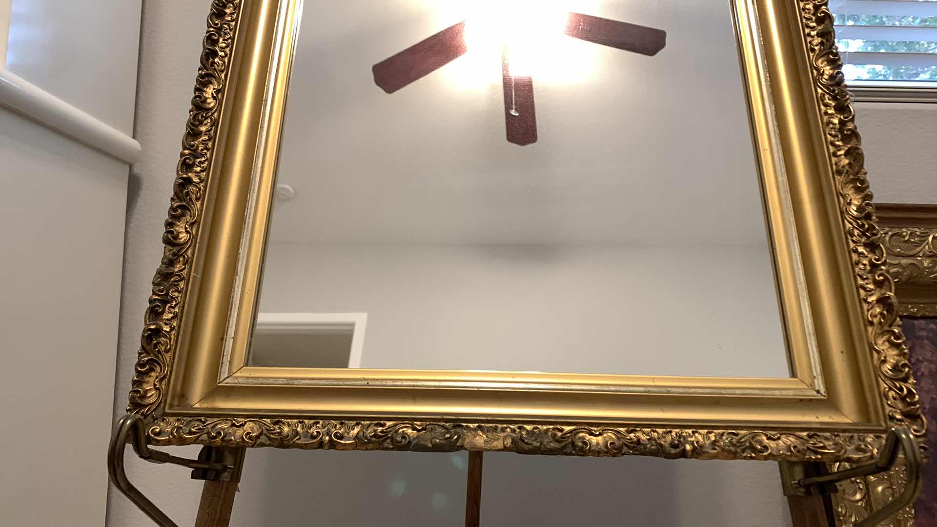 Photo 1 of VINTAGE MIRROR IN ORNATE GOLD FRAME 20.5” x 27.5” (stand not included)