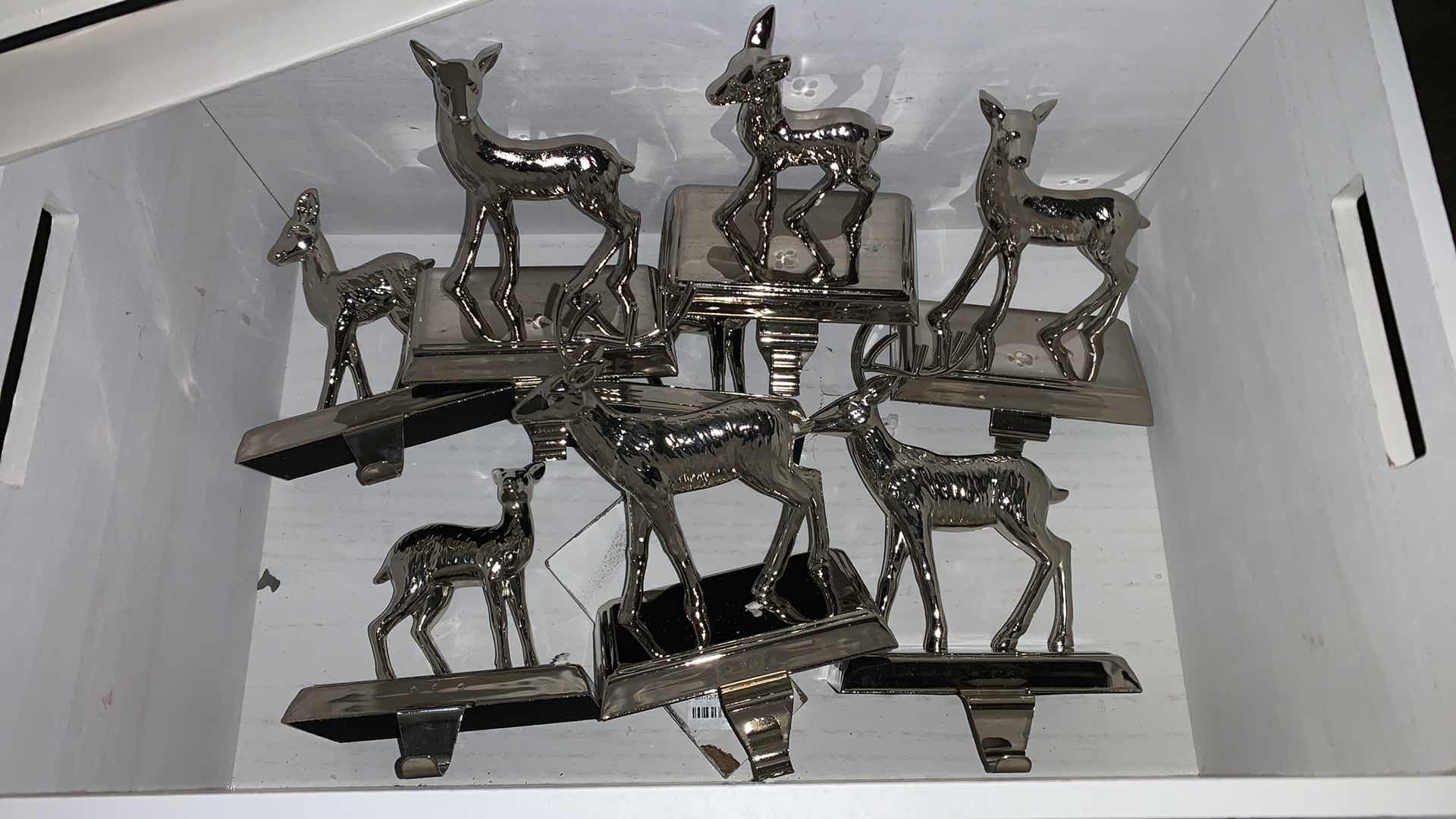 Photo 1 of BOX OF CHRISTMAS ITEMS, 2 SETS OF 4 REINDEER STOCKING HOLDER