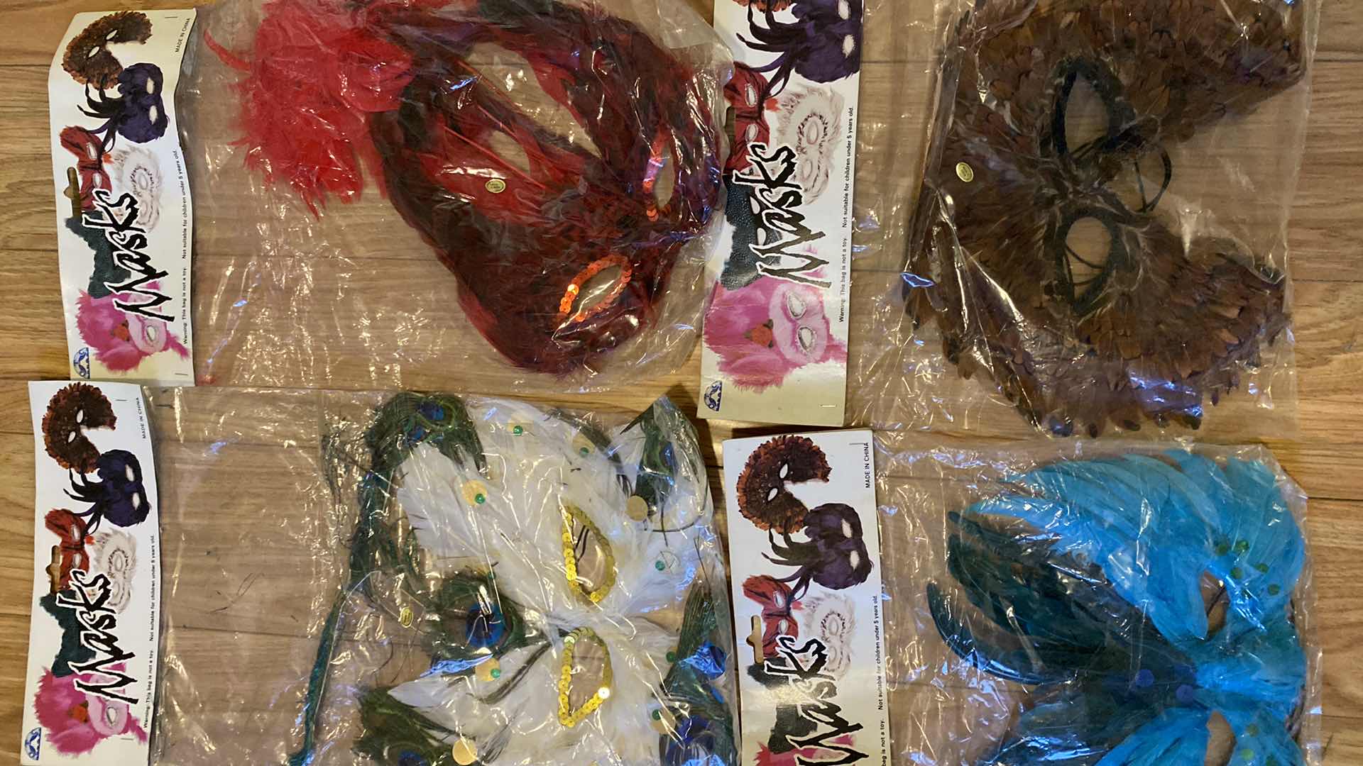 Photo 1 of NEW 4-FEATHER MASKS