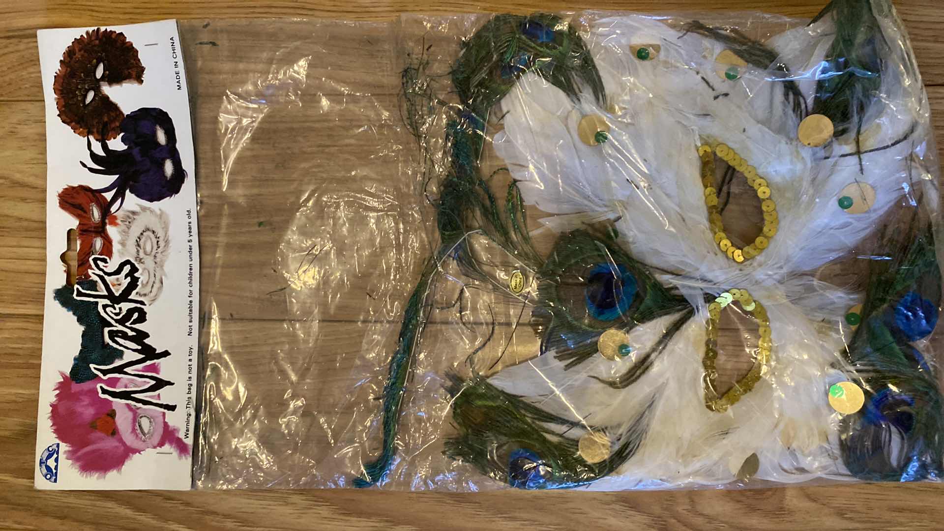 Photo 2 of NEW 4-FEATHER MASKS