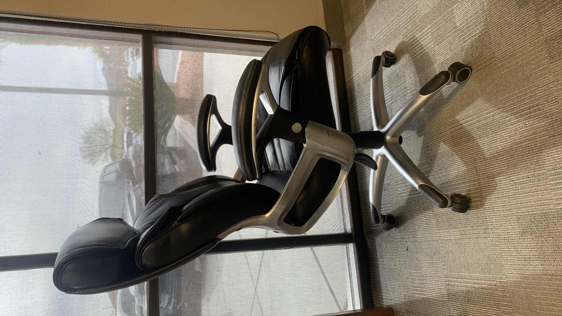 Photo 1 of TRUE INNOVATIONS BLACK BONDED LEATHER ADJUSTABLE ROTATING EXECUTIVE OFFICE CHAIR w WHEELS