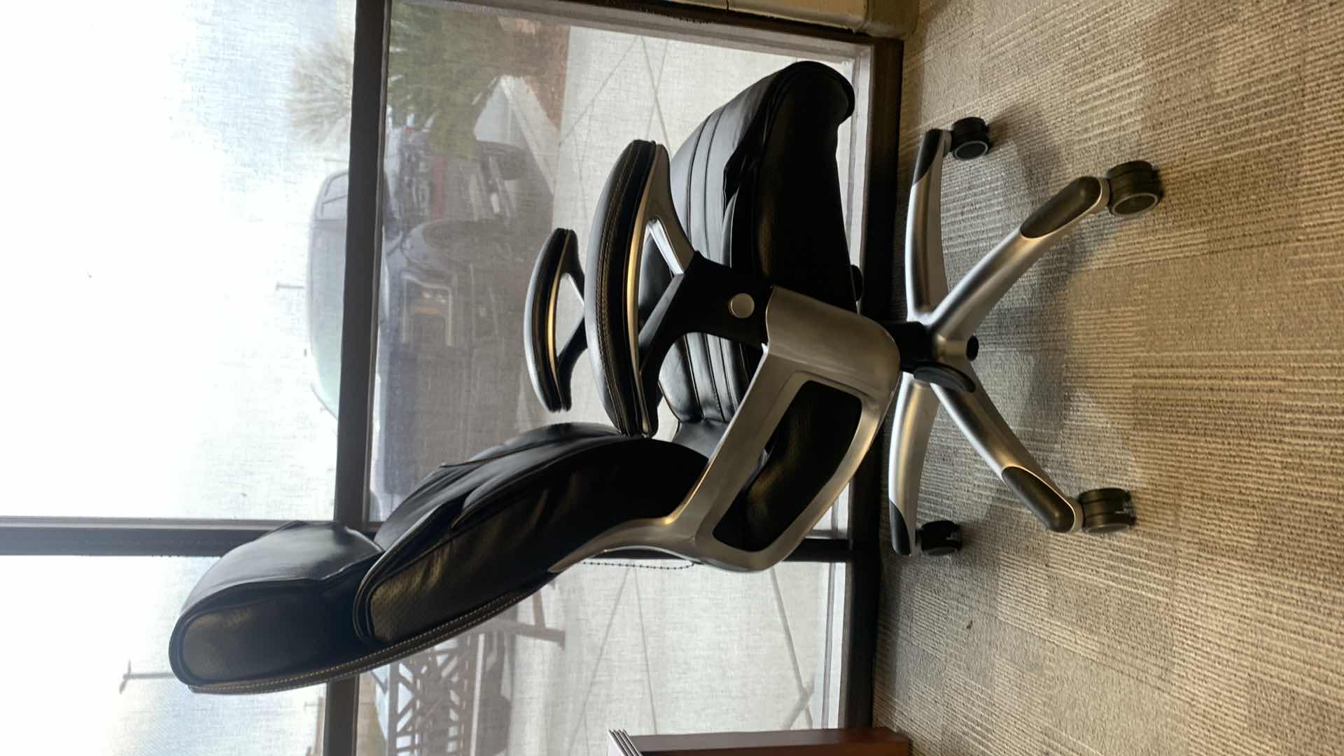 Photo 1 of TRUE INNOVATIONS BLACK BONDED LEATHER ADJUSTABLE ROTATING EXECUTIVE OFFICE CHAIR w WHEELS