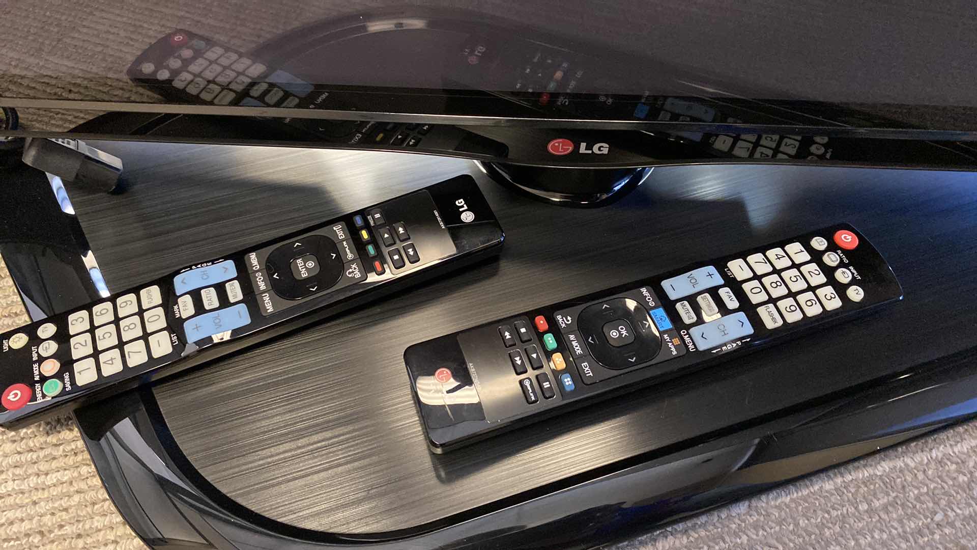 Photo 1 of LG 62” PLASMA TV WITH SWIVEL BASE AND REMOTES