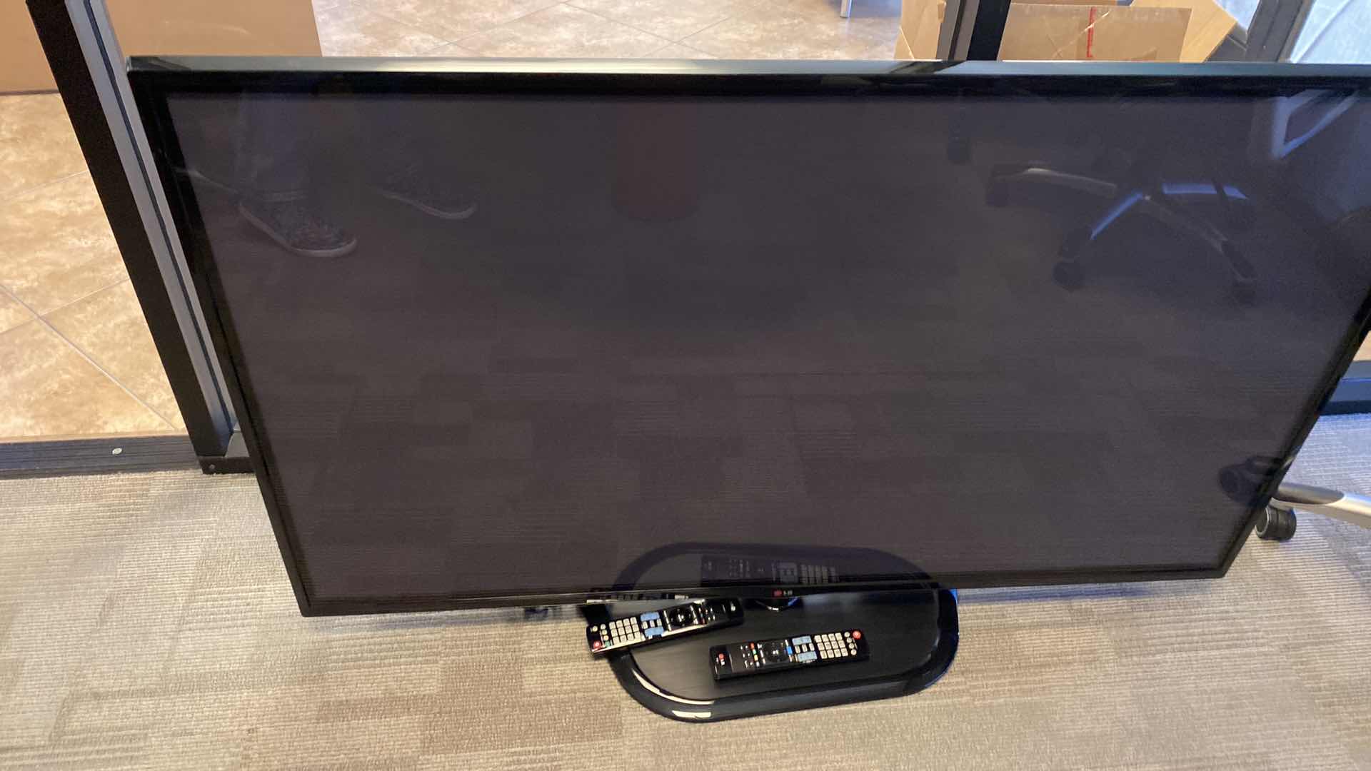 Photo 1 of LG 62” PLASMA TV WITH SWIVEL BASE AND REMOTES