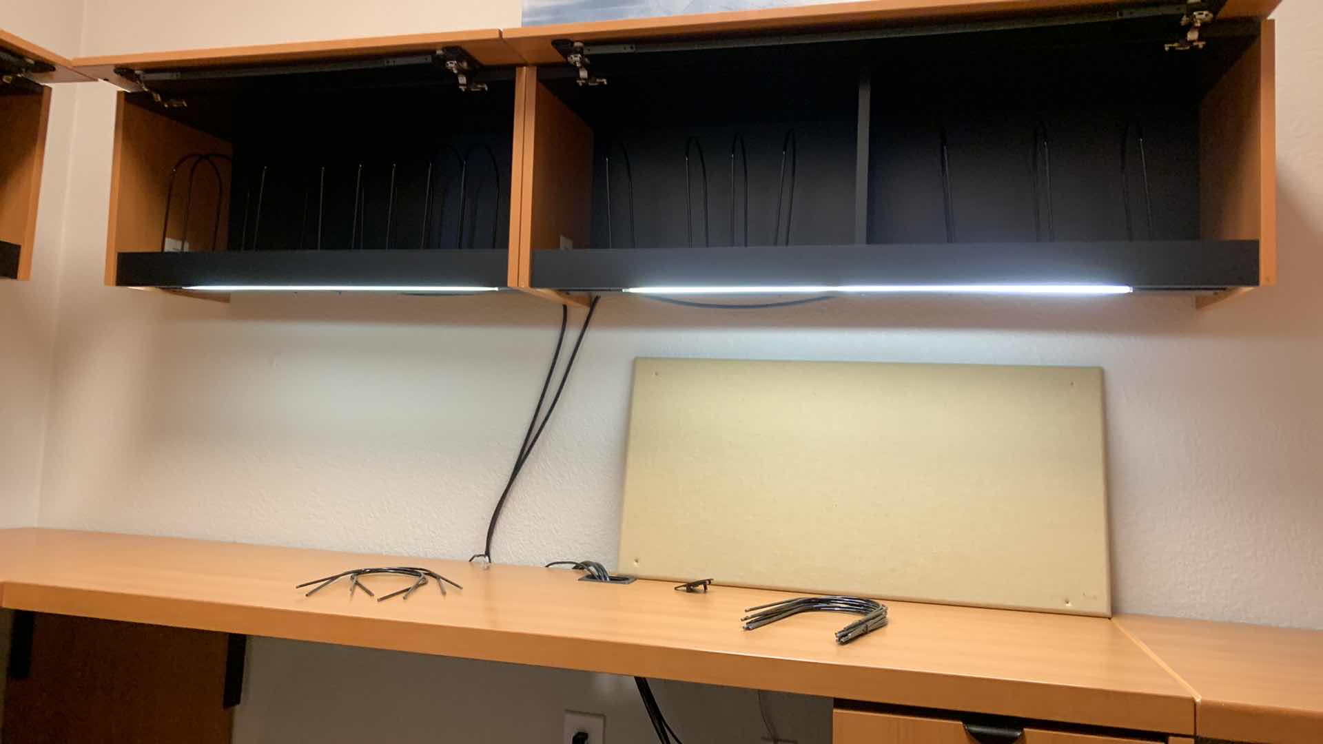 Photo 1 of MAGNA DESIGN LAS VEGAS WOOD WORK STATION/ OFFICE CORNER DESK UNIT TWO LOWER DESKS  72” x 24 WITH FILE CABINETS, TWO SOUND BOARDS AND THREE UPPER CABINETS WITH LIGHTS AND METAL DIVIDERS